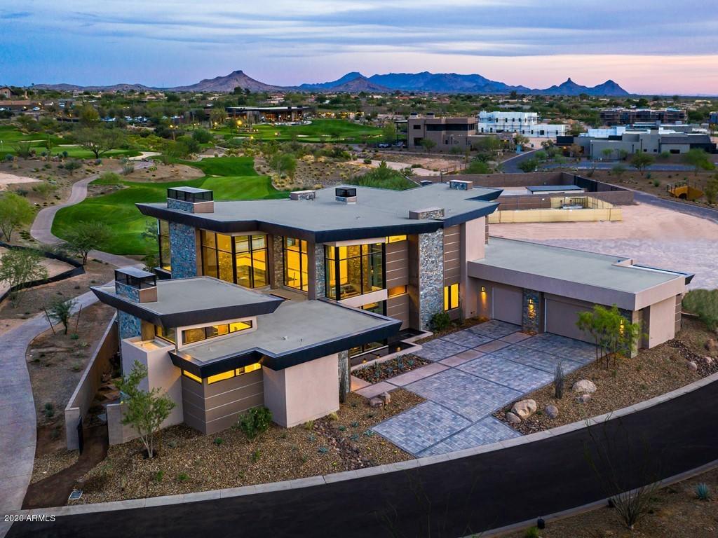 OUR INCREDIBLE, 9,567 SF, 4 BEDROOM, 5 BATHROOM MODEL IS NOW FINISHED AND READY TO SHOW! NOTHING SHORT OF SPECTACULAR. THIS DREAM HOME IS WHAT YOU'VE BEEN WAITING FOR. SURROUNDED BY SWEEPING MOUNTAIN AND GOLF COURSE VIEWS, THIS NEWLY BUILT CUSTOM RESIDENCE SHOWCASES MASTERFUL CRAFTMANSHIP THROUGHOUT. THE DRIVEWAY TO THIS ESTATE LENDS AMPLE SPACE FOR MULTIPLE CARS AND GUEST VEHICLES ALONG A EXTENDED GARAGE AREA THAT CAN FIT UP TO 7 CARS. THE FRONT DOOR IS ACCESSED THROUGH AN EXQUISITE PRIVATELY GATED COURTYARD. DU CHATEAU FLOORING THROUGHOUT THE HOME. THE GREAT ROOM FLOWS INTO THE CHEF'S KITCHEN AND OPENS TO THE COVERED PATIO AND PRIVATE NEGATIVE EDGE POOL. AN ENTERTAINER'S PARADISE! THE CHEF'S KITCHEN WITH HAND CRAFTED CABINETRY, SUB ZERO AND WOLF APPLIANCES, WALK-IN PANTRY AND LARGE CENTER ISLAND OVERLOOK THE TRULY REMARKABLE GREAT ROOM AREA WITH A FLOOR TO CEILING FIREPLACE WALL. AN ABUNDANCE OF WINDOWS OFFERS NATURAL LIGHT AND INCREDIBLE VIEWS EVERYWHERE YOU LOOK. THE MAIN LEVEL ALSO FEATURES AN OFFICE AREA, MASTER SIZE BEDROOM WITH EN-SUITE BATH, ADDITIONAL GUEST BEDROOM WITH EN-SUITE BATH, POWDER BATH FOR YOUR GUESTS AND A LARGE LAUNDRY ROOM. A PRIVATE ELEVATOR TAKES YOU TO EVERY LEVEL OF THE HOME, INCLUDING THE FULL BASEMENT. THE "19TH HOLE" BASEMENT ENTERTAINMENT ZONE HAS IT ALL. THEATER AREA, GAMING AREA, POWDER BATH, FULL WET BAR WITH EAT-UP BAR SEATING AND WINE CELLAR. FULLY EQUIPPED WITH INDOOR GOLF SIMULATOR AND GLASS-ENCLOSED COLLECTOR CAR SHOWROOM. THE ENTIRE TOP FLOOR IS THE OWNER'S SUITE.  LARGE ADDITIONAL SEATING AREA IN THE LOFT SPACE FEATURES A TWO-WAY FIREPLACE WALL INTO THE MASTER BEDROOM. A WET BAR EQUIPPED WITH A WINE STATION AND COFFEE BAR FOR CONVENIENCE. ACCESS TO THE PRIVATE VIEWING DECK WITH EXCEPTIONAL VIEWS OF THE GOLF COURSE AVAILABLE THROUGH THE LOFT AREA. DECK IS ALSO ACCESSIBLE THROUGH THE MASTER BEDROOM. ENORMOUS HIS AND HERS MASTER CLOSET INCLUDES WASHER AND DRYER. BEAUTIFUL MASTER BATHROOM FEATURES A SOAKNG TUB, DUAL SINK VANITIES, WALK-IN SHOWER AND PRIVATE TOILET ROOM. THIS HOME IS COMPLETE WITH A GUEST CASITA. SEPARATE ENTRANCE FOR YOUR GUESTS' PRIVACY, LIVING AREA WITH A FIREPLACE, KITCHENETTE, PRIVATE BEDROOM AND FULL BATHROOM. HOMEOWNERS AT SEVEN DESERT MOUNTAIN WILL BECOME EITHER A LIFESTYLE OR EQUITY GOLF MEMBER AT DESERT MOUNTAIN, GAINING ACCESS TO ITS WORLD-CLASS AMENITIES INCLUDING THE NEWLY RENOVATED SONORAN SPA AND FITNESS CENTER, TENNIS COMPLEX, HIKING AND BIKING TRAILS, SIX ADDITIONAL PRIVATE GOLF COURSE, LUXURIOUS CLUBHOUSES AND RESTAURANTS. COMMUNITY IS GUARD-GATED 24/7 FOR THAT "LOCK-N-LEAVE" LIFESTYLE ONE SO DESIRES.