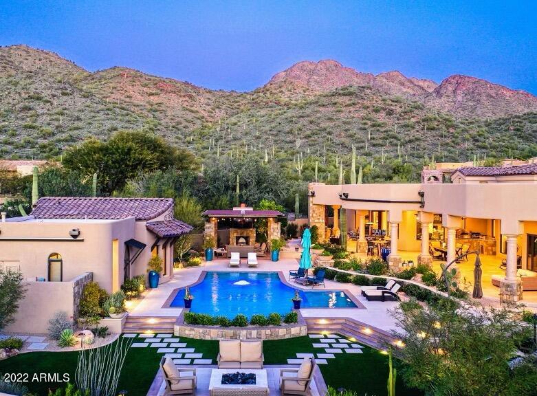 Phenomenal, luxury resort in the exclusive, guard gated hideaway in Lost Canyon. Remodel just completed and no detail overlooked. This upscale, extremely private, resort like estate has breathtaking Mountain View's, amazing sunsets and a feeling of serenity now! Your guests will be blown away when they arrive at the 300 ft plus winding, paver driveway, over the bridge up to this amazing mansion in the enclave of the hills. You'll be amazed how quiet and remote this estate feels, yet minutes from all the best restaurants, golf and neighboring resorts in North Scottsdale. Tom Argue custom home and his staff even did the extensive remodel with interior renovation and exterior transformation of the oasis backyard. The old pool and deck were completely torn out and redesigned
