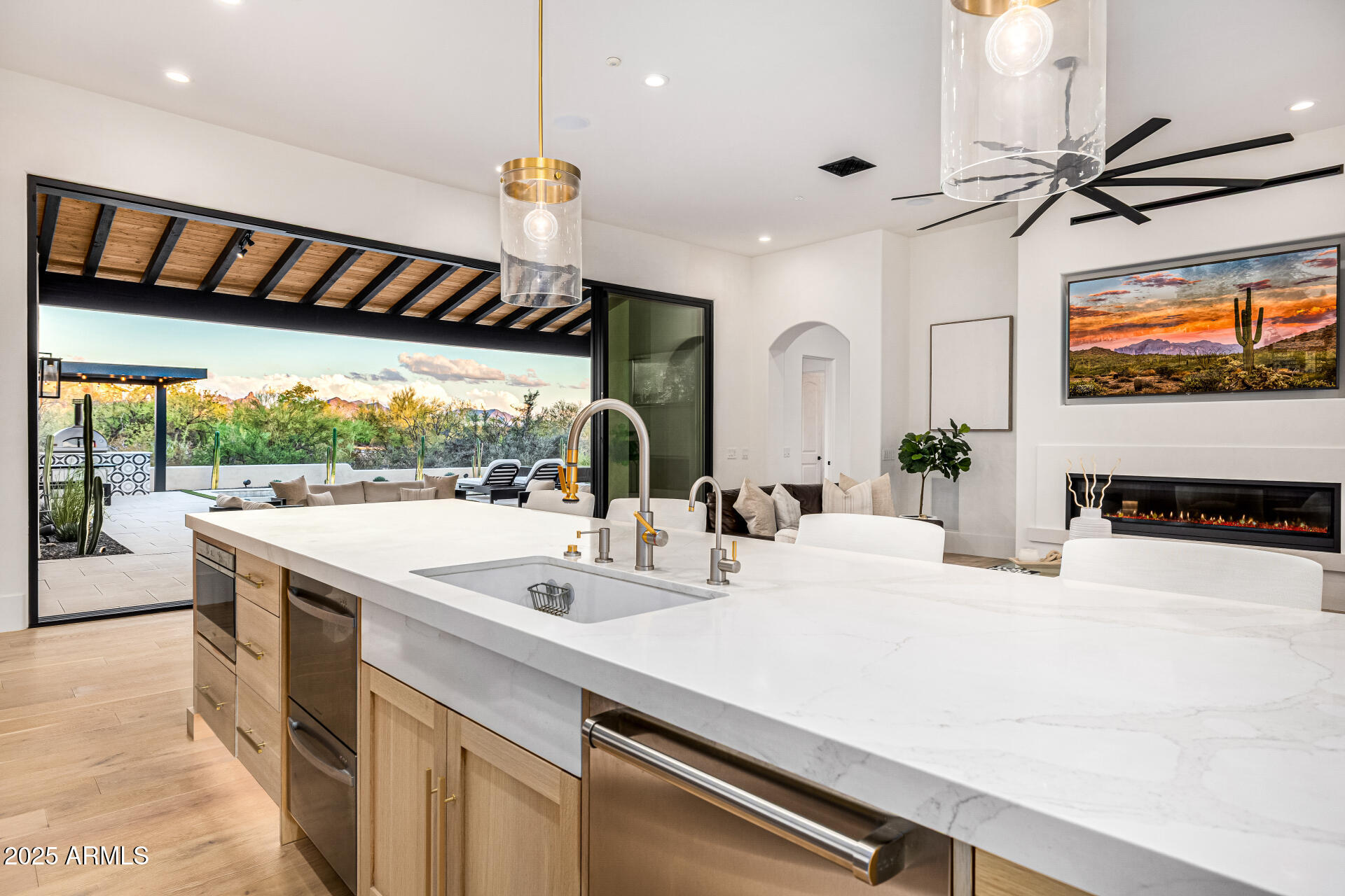 Immaculately remodeled custom home in Scottsdale's gated Lone Mountain Estates redesigned by Lindsay Kadlick & reconstructed by Trinity Homes. Situated on a private 1.827 acre lot, the home features new interior finishes along with a new pool/spa & outdoor kitchen & new entertainment areas.   All of the living space is on main level with a split master suite & the guest suite on 2nd level.  Home features new oak flooring, white oak cabinets, quartz countertops, new Sub Zero, Wolf and Cove appliances, dual wine towers, Miele coffee maker, a complete ''dirty kitchen''/pantry, new bathroom finishes, a new 22 ft. panel glass slider, Control 4, new interior plumbing, lighting, etc.  Bonus theater room that could be golf simulator room.  Outdoors new pool/spa, BBQ, pizza oven and pool hardscape