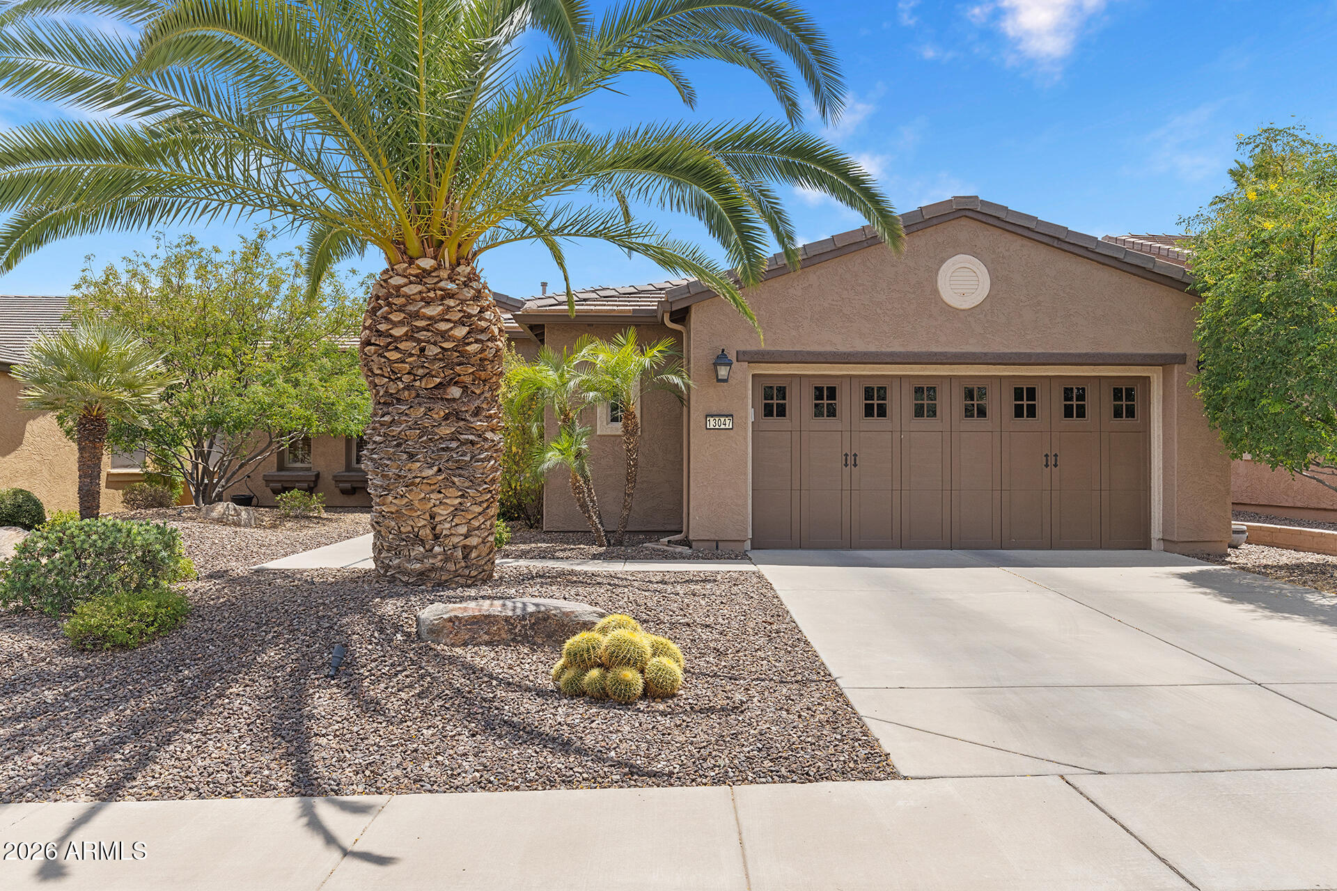 Resort-Style Living in Trilogy at Vistancia! Enter through the foyer into a spacious formal living or dining area filled with natural light from oversized windows, flowing seamlessly into the kitchen featuring a center island, granite countertops, stainless steel appliances, abundant cabinetry & an eat-in area. The family room is anchored by a cozy tile fireplace & large picture windows. The primary suite is generously sized with tons of natural light & ensuite showcasing dual vanities, walk-in shower & oversized walk-in closet. A secondary bedroom, full bath & separate den/office offer flexible living space with potential for a 3rd bedroom. The backyard features a covered patio, desert landscaping & room to customize to your liking. Additional highlights include a new water heater & water softener installed in 2021, plus two AC units replaced in 2021 & 2017. Located in the award-winning Trilogy at Vistancia 55+ community with resort-style amenities including golf, pools, fitness centers, pickleball, tennis, walking trails, spa, clubs, dining & more, plus convenient access to Loop 303, shopping, dining & recreation!