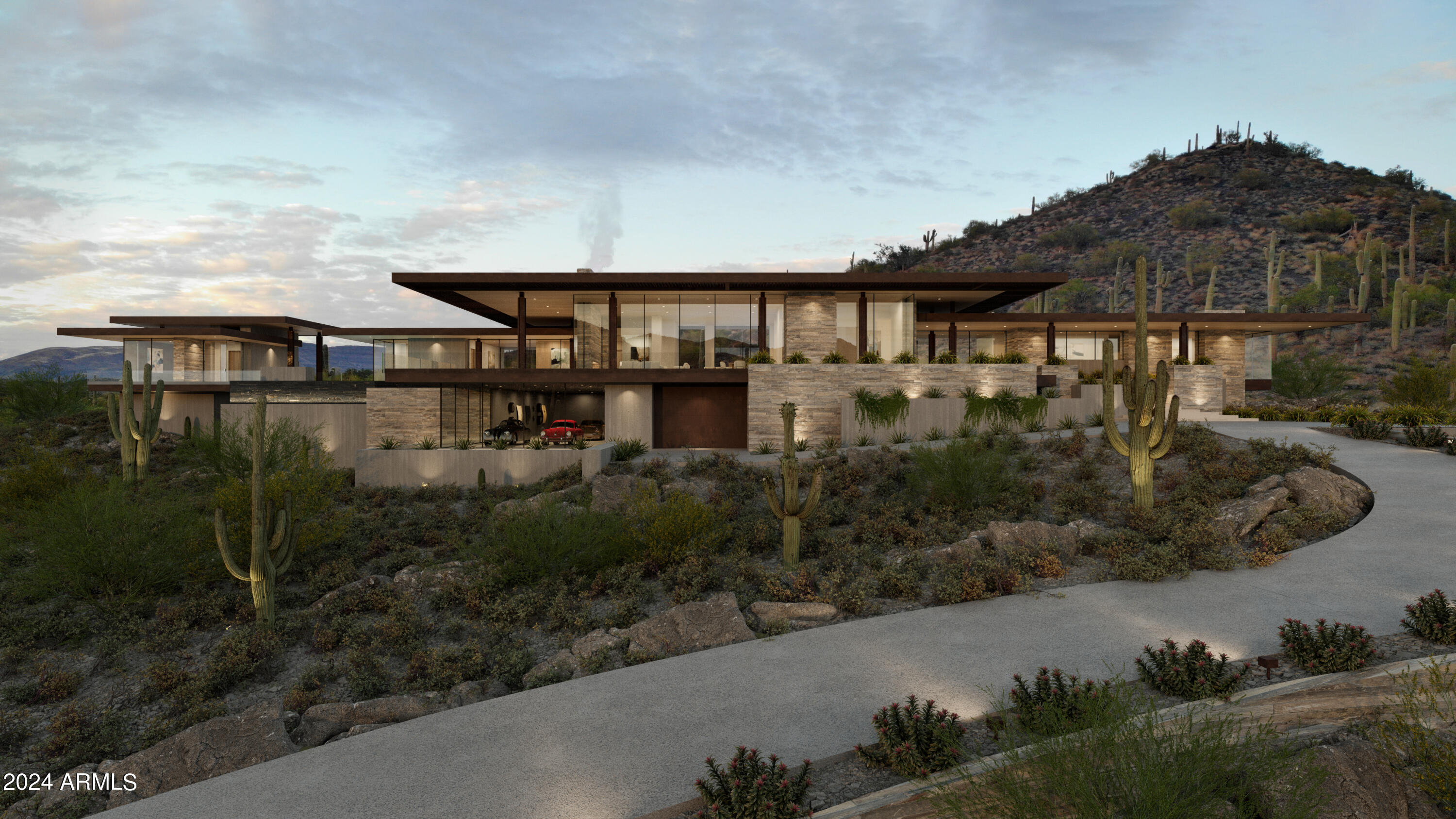 The Six Shooter residence seamlessly floats in harmony with the natural landscape through carefully selected rustic materials, such as rubble stone, concrete and raw steel. Perched high on the gentle hillside, this home offers panoramic views and ultimate privacy amidst ancient saguaros. The lower 7-car show garage not only serves as a focal point, but elevates the home even higher, transcending the hillside for commanding views. The great room is an open-concept space that seamlessly connects the front terraces with mountain vistas unfolding before you. The private primary suite, strategically hovering above the desert, offers utmost seclusion and astonishing views. The guest wing and lounge open up to the pool and terrace area, creating an oasis for relaxation and social gatherings.