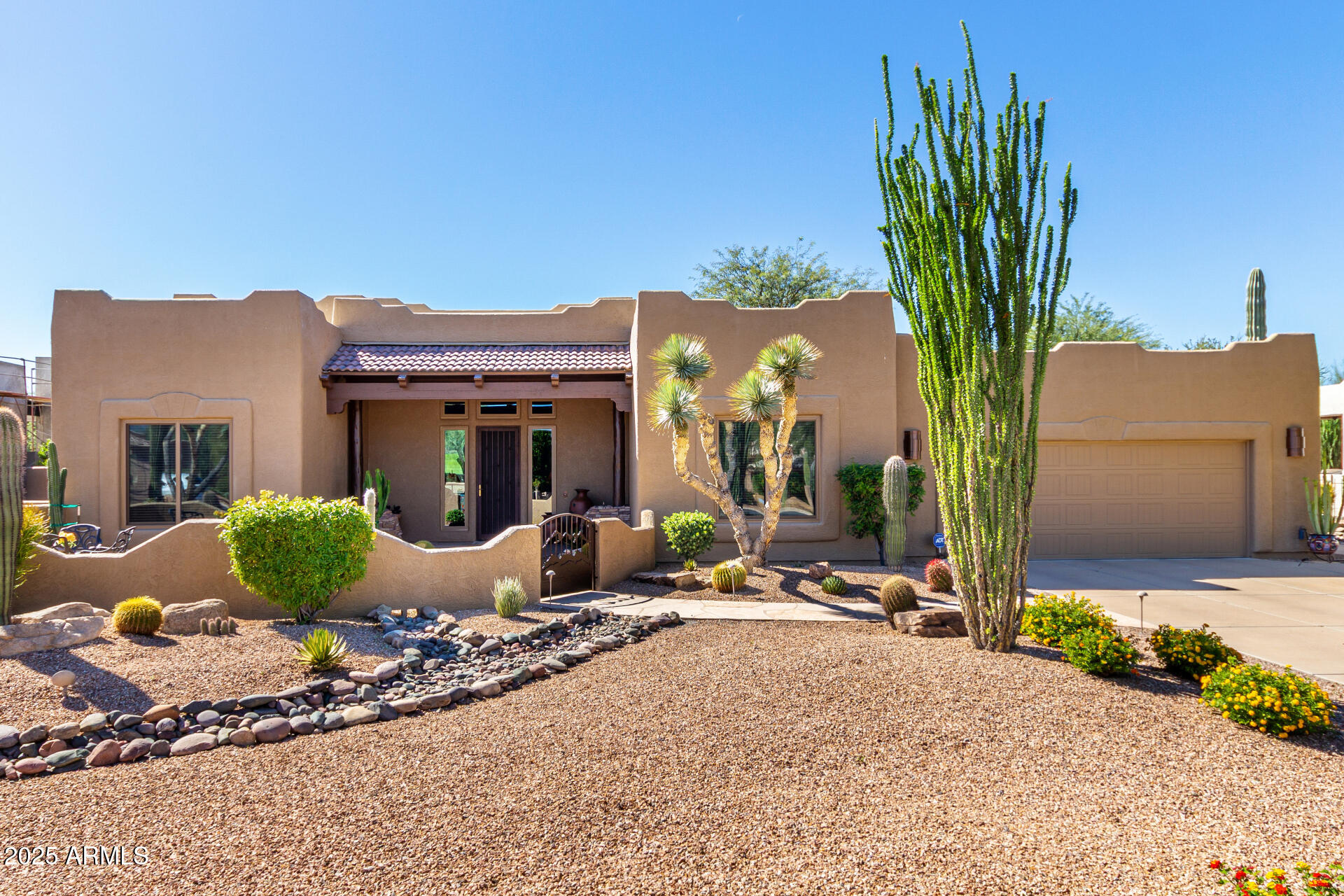 Exquisite Territorial home situated on the 13th hole of the Peaks Golf Course at Tonto Verde. The Seller has a transferrable golf membership so there is no wait-list. The front courtyard features flagstone, mature landscaping & gated. The front entrance has a custom security Screendoor with sidelights. The Great Room features Travertine flooring and a soaring ceiling. LED lighting throughout. Maverick ceiling fans, & fireplace with hammered copper accents. The dining room features a newer , floor to ceiling Anderson window, for a unique golf course view. The updated kitchen features custom Affinity cabinetry.
Stainless steel appliances, under counter microwave,Taj Mahal quartz counters, center island, tile backsplash rain glass windows, composite sink, exhaust hood.  see More... Breakfast bar in updated kitchen. Primary bedroom has tray ceiling, wood floors and slider to patio with double custom screen doors. Primary bath has custom stained glass over the soaking tub, Quartz counters, lights come through the mirror, snail shower w/custom tile, watercloset w/comfort toilet. Walk in California closet with built-ins. Guesst bedroom is adjacent to a full bath with custom tile shower, framed mirror, vessel sink, comfort toilet & rain glass window for privacy. Den/office/3rd bedroom has solid wood double doors, wood floors, built-in desk, file drawers, bookcases & is attached to a full bath with custom wood vanity, copper sink, mirror, walk-in shower with custom tilework. The home has an oversized laundry room with extra cabinets, sink & closet. Rear patio was inlarged with a special beam to improve site line views. Flagstone patio has 3 ceiling fans, the 10 ft. slider lines up with the tall bay window and a spiral staircase takes you to the view deck for those Arizona sunsets. The covered patio also includes a built-in bar and BBQ island. The flagstone continues to the Kiva fireplace with large banquet seating area.The patio has electric awning with wind detector to close automatically.
The flat roof was recoated in 2023. The property has 11 Sagurao
cacti and the low wall keeps the javelinas out. 
Additional upgrades include:
Multiple Anderson windows & Doors
Energy efficient LED lighting throuout
Updated smoke detectors w/10 yr. warranty
Inline recurculation hot water pump
2 Newer A/C units installed 2019
New insulated garage door
Custom garage cabinets & work bench
Garage epoxy floor
Professonally desighed landscaping with LED lighting system
Some furniture may be available on a seperate bill of sale.
Seller would like to rent back or extended closing date.
Two golf carts will be included if the buyer purchases the sellers golf membership.