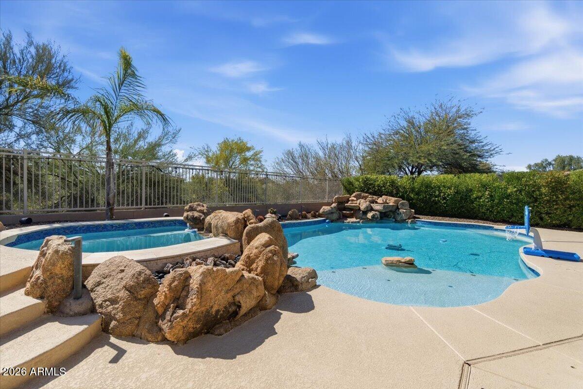 Experience resort-style desert living at 4429 E Happy Coyote Trail. This upgraded home features a chef's kitchen with new granite countertops and a quartzite island (2025), Wolf induction range, and Thermador dishwasher. Step outside to a backyard designed for Arizona indoor-outdoor living with New Pentair pool automation system, a high-pressure misting system with integrated pool foggers, and a premium outdoor sound system. Recent improvements include a new HVAC system (Sept 2024) and reverse osmosis water filtration. With thoughtful upgrades and resort-style amenities, this home blends comfort, style, and entertaining with desert luxury. Kitchen
 " Quartzite kitchen island - 2025
 " Granite countertops - 2025
 " Wolf induction range
 " Thermador dishwasher

Major Systems
 " New HVAC - Sept 2024 (~$24K)
 " Pool automation (~$5K)

Outdoor Living
 " High-pressure misting system with pool foggers (~$6K)
 " Premium outdoor sound system (~$15K)

Additional Features
 " Reverse osmosis (R/O) water filtration