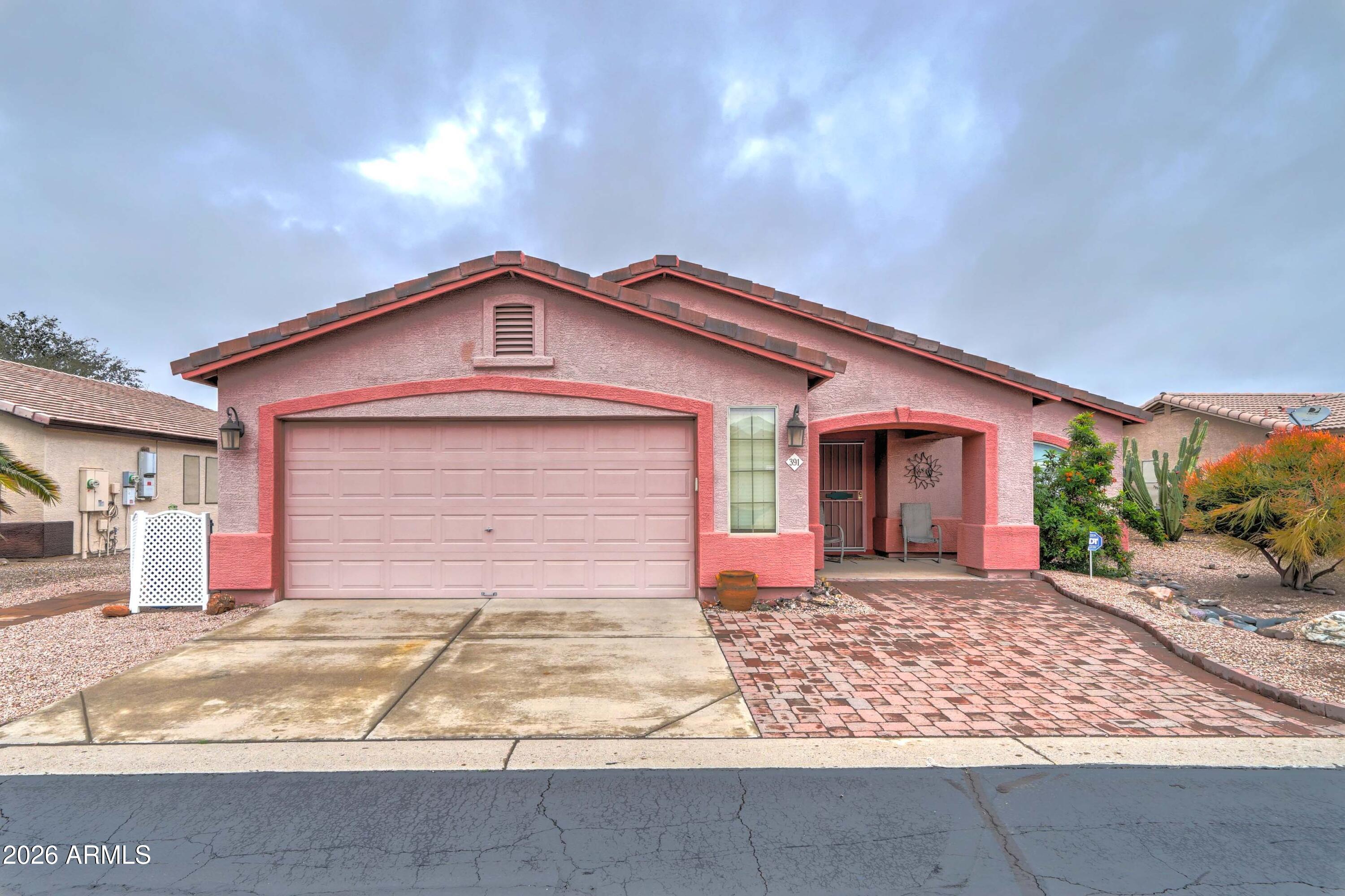 You will love this great-room style home with a formal dining area, over 1700 sq. ft. and an expanded garage. Very well kept and neutral colors , This home is bright and inviting with lots of natural light!. If you are looing in MM you wont find them in this size very often! Come see what has made Meridian Manor the choice in the East Valley for 55 plus living! Great clubhouse with library, fitness center, 6 billiard tables, craft room and Ballroom. Pickleball, shuffleboard and heated pool and Jacuzzi have a spectacular view of the Superstition Mountains! You'll love it!!