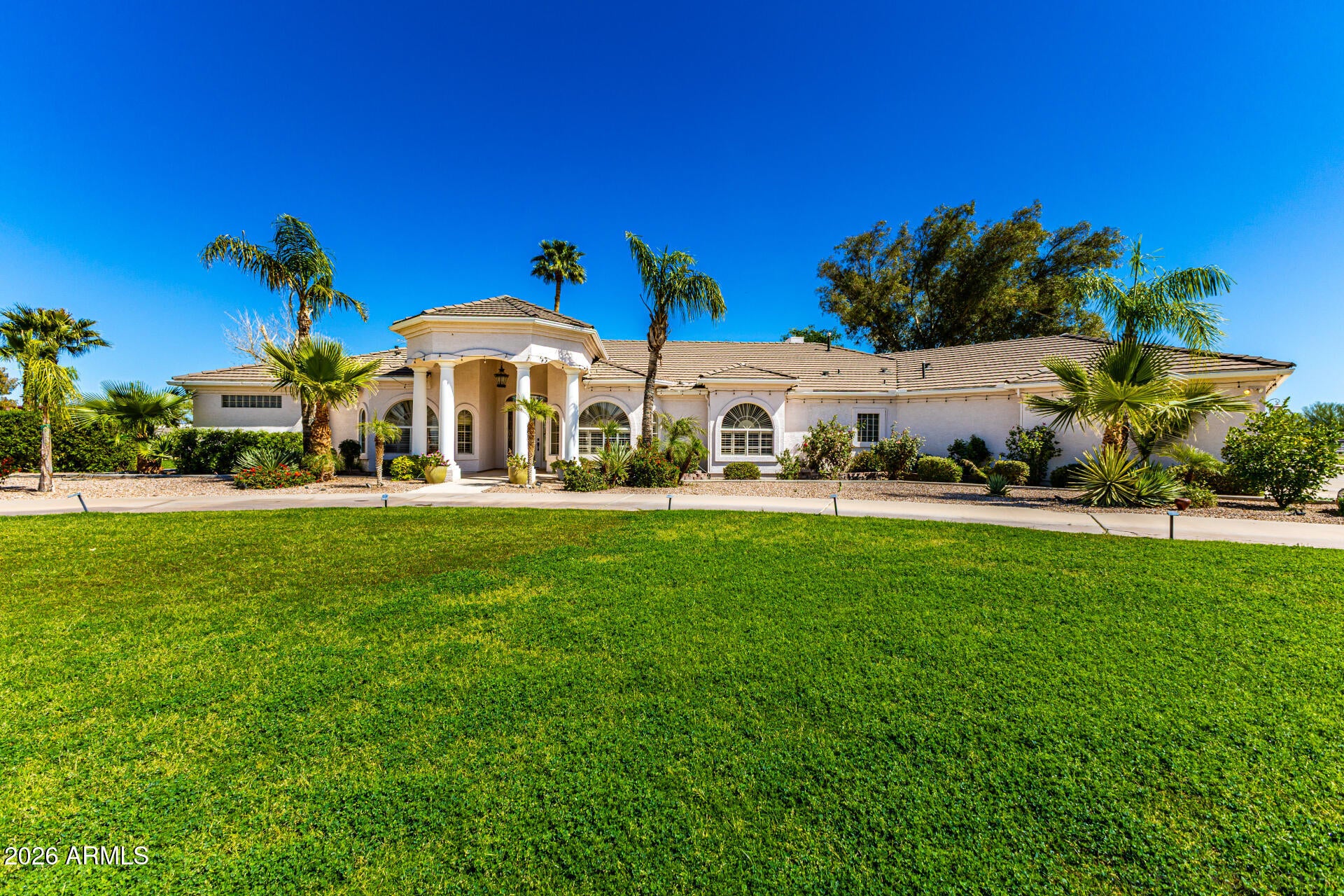 Prepare to be amazed! Check out this luxurious 5 bed, 4 bath residence now for sale in San Tan Valley! Nestled on a HUGE 3.5 acre corner lot & featuring a stunning facade, a manicured landscape w/lush natural turf, and a 3 car garage plus a detached RV garage & workshop. Come inside to discover a welcoming foyer which flows seamlessly into formal dining & living areas showcasing soaring ceilings w/crown molding, stylish columns, elegant wood-look flooring, soft carpet in all the right places, dazzling light fixtures, and plantation shutters. The gourmet kitchen is truly worthy of a chef, comprised of staggered cabinetry w/granite counters, tile backsplash, SS appliances, a prep island, and a peninsula complete w/a breakfast bar. New roof 2yrs ago, HVAC 5yrs ago