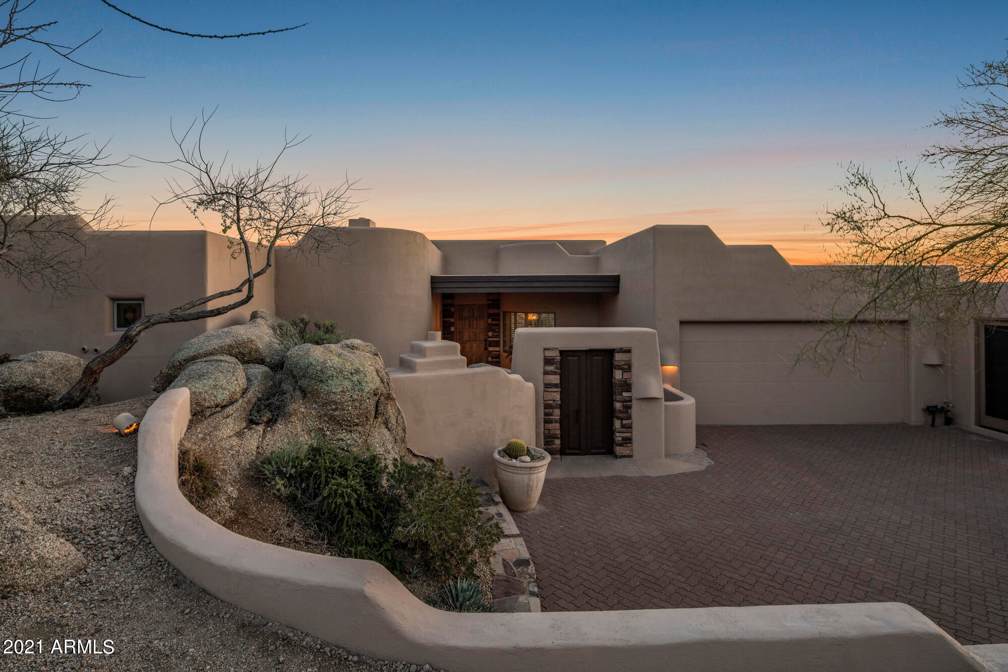 Fantastic setting nestled into the natural boulders in the Village of Rose Quartz, this beautiful soft contemporary by Salcito Custom Homes awaits.  The gated,  private entry courtyard enjoys a cozy fireplace and north facing views to Apache Peak.  Great Room is light and bright with floor to ceiling windows framing the view over the resort style back yard, stone gas fireplace and Wet Bar.  Comfortable split floorplan features 3 bedrooms, 3.5 baths and a specious Study with corner fireplace, east patio access and south facing view balcony.  Luxurious Master Suite with sitting area, fireplace, walk-in closet.  Two Guest Rooms have ensuite Baths. Gourmet Kitchen with large center island, new appliances, breakfast nook and open to Family Room  (could be Bonus/Game Room) You'll enjoy the gorgeous Sonoran Desert and spectacular sunsets with a twinkle of city lights from the multiple outdoor entertaining spaces, including covered Living and Dining patios, built-in BBQ, exterior fireplace, along with sparkling pool and spa with waterfall.  Immaculate 3 car garage, fresh paint inside and out, brand new roof!  This beauty is move in ready and furnishings can be purchased to make this fully turnkey.  Membership to the Desert Mountain Club not included in price, but available through the Membership Dept.