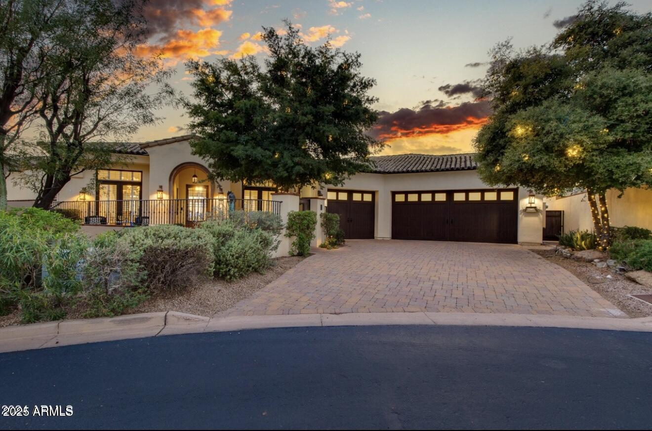 This beautiful home, situated at the end of a quiet cul-de-sac in the highly coveted guard-gated community of Paradise Reserve, features exceptional quality and excellent craftsmanship. Each room features high ceilings, fresh design elements, sleek surfaces and tailored detailing. The island kitchen is the center of the home offering custom cabinetry, Taj Majal quartzite countertops, two sinks, stainless and cabinet grade appliances, and designer lighting. The exquisite great room perfectly combines elegance and comfort with a gorgeous fireplace as its focal point, oversized glass inset doors that open to the lovely backyard, and custom-built cabinetry framing art niches and bookshelves for endless design opportunities. Both formal and informal dining rooms offer luxurious entertaining options for both kids and adults alike, and all the bedrooms are ensuite including a lavish primary retreat with a stylish spa-like bath and huge his and hers closets. Substantial millwork, chic lighting, polished stone flooring, and sun-drenched spaces fill the home with light and life, and a dedicated office built to accommodate a professional work environment or computer stations for kids and grandkids is a special bonus. The delightful backyard features a spacious covered patio and spectacular city and mountain views, and the oversized 3-car garage provides ample space for not just the cars, but tons of storage as well. All this luxury combined with a perfect location within minutes of world-class dining, shopping, golf, and hiking create an impressive lifestyle. Live in it year round or lock, leave and head out to your favorite vacation spot!