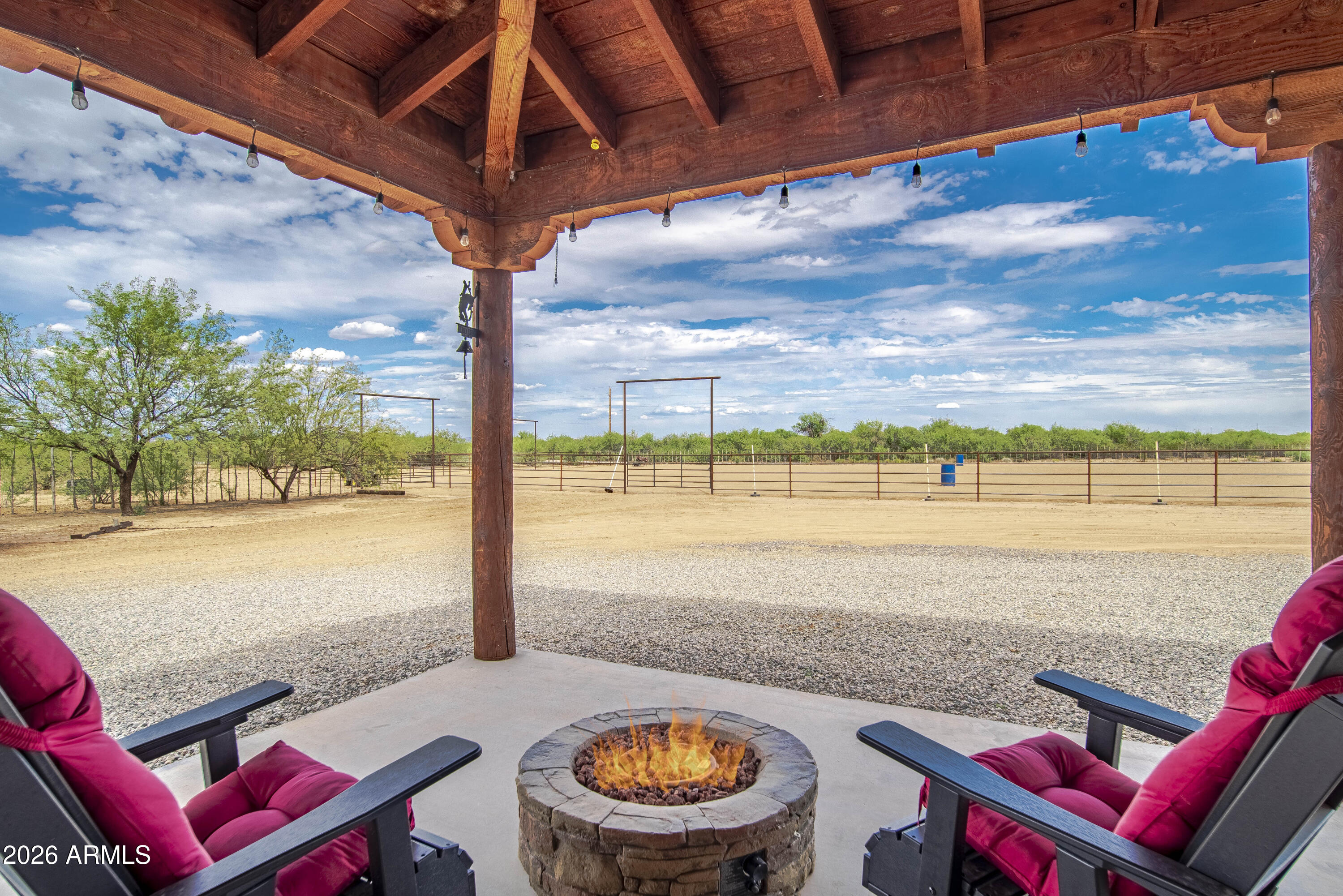 Everyone says they want a horse property and this one is done right! This 2 bed, 2 bath home has an attached 1 bed, 1 bath casita and sits on 5 acres. Fully furnished, it boasts a large garage which can easily fit a dually or 3 horse bumper pull trailer, two RV Spots and a 147' x 222' arena with specialty footing brought in. Six 16' x 16' covered pens are available but there is still plenty of acreage for expansion if you need a barn, more pens, big turnouts or want to expand the arena. There is also a 12' by 30' fully enclosed barn with a large overhead door and a walk-through door, expansive hay storage, tack area and loft, situated next to the mare motel. Two gated entrances for easy turn-around and ample trailer parking. The Connex box is ideal for storage, a tack room or workshop. This property is turn key and ready to go with plenty of room to make it yours. If you've ever dreamed of waking up, saddling your horses and roping in your own arena, this is what it actually looks like in Wickenburg.
