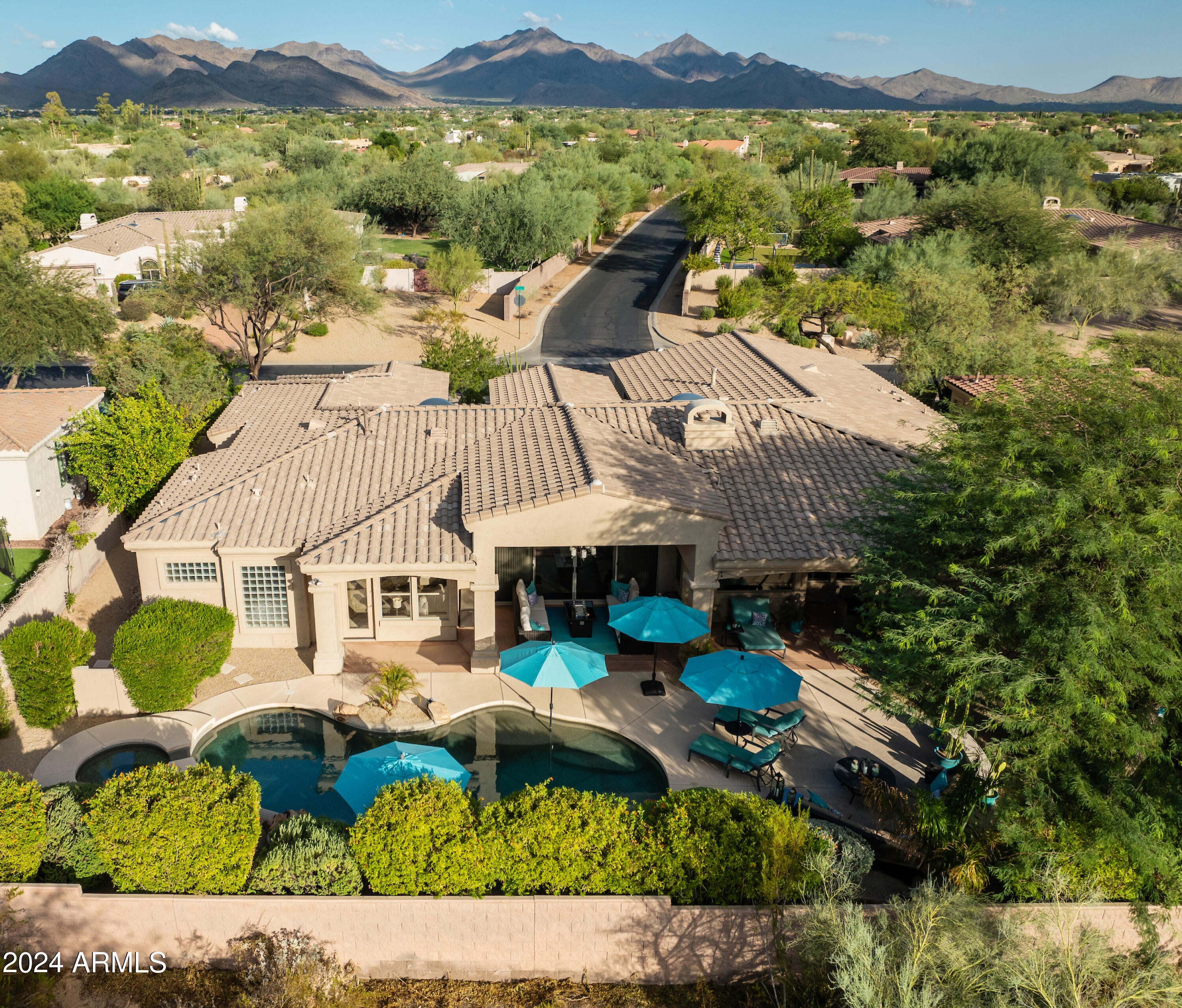 This contemporary home features open-concept living, a resort-style backyard with heated pool & spa, an  updated gourmet kitchen with Bosch appliances, Viking built-in fridge and 5 burner gas cooktop. This wonderful family home is ideally located behind a private gate and just a 5 minute walk to the ''A'' rated K-8 Pinnacle Peak Preparatory School and dog friendly Sonoran Hills Park. The spacious great room has oversized sliding doors that open onto to the covered patio and pool area. Entertain in the private and lush backyard oasis (no houses directly behind) while enjoying awe-inspiring sunsets. Cool off in the sparkling pool or hang out with family & friends under the covered patio while grilling on the built-in BBQ. Retreat to your large primary bedroom and luxurious bathroom ...cont. w/dual vanities and deep jetted tub. Home includes a wet bar, designer finishes and Restoration Hardware fixtures. Close to the 101, restaurants, world class shopping, golf and hiking. New roof installed in 2019. Exterior painted in 2020. See Documents Tab for full list of upgrades.