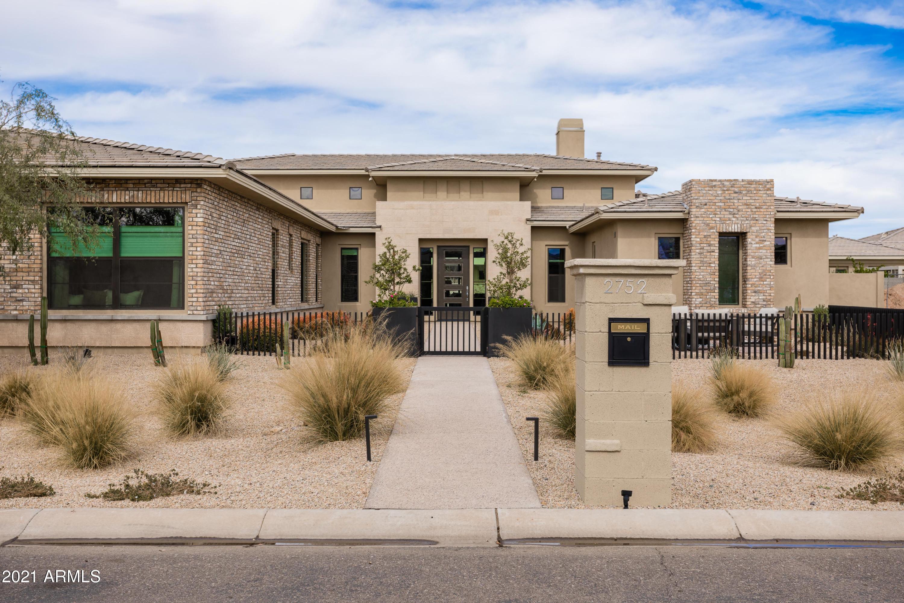 Want a truly move-in ready contemporary home? CHECK. Need a yard/pool where everyday is a vacation day? CHECK. Want indoor-out living w/patios & courtyards for all? CHECK. Want fireplaces everywhere & telescoping walls? CHECK. You get the point, as does this Immaculate Toll Brothers guard gated luxury-everything home. A true great room w/ 16' soaring ceilings & artistic tile walls that transition to an America's Test Kitchen-worthy gourmet space for the chef in us all. An owner's suite that you deserve w/ a Kohler soaking tub under a bubbles chandelier, 2 closets, courtesy laundry & more. Kids/guests don't suffer either w/ their own bonus room, ensuite, split hallway, custom paint, tile & quartz. Work-at-home office rounds out everyone's needs. Too many special features to list - SEE MORE. Outstanding Features:

Patios galore - front courtyard, great & family rooms and one off owner's suite
Full telescoping doors in great room
High ceilings throughout and 16 feet in great room
Completely custom finishes
Travertine tile through whole back and front yards
Fire pit seating area in front gated courtyard
Floating fire pit on pool platform in backyard
Blue and orange fire feature in great room
Wide plank light beach-y tile through home w/ luxury carpet
Designer finishes and vignettes through home
Incredible luxury lighting throughout the home & ceiling fans
Owner's suite and a junior suite as well
Oversized kitchen island with thick slab quartz throughout
48" oversized Kitchen Aid stainless side by side 
48" gas Kitchen Aid stove with 6 burners & a griddle
2 Kitchen Aid wall ovens
Sharp drawer open microwave
Double RV gate and huge wrap around lawn
Large laundry room with hanging rod & counter space
Front load LG steam dryer & HE washer in main laundry
Courtesy stacked laundry in owner's suite
Jack & Jill bedrooms have double vanities and shower/tub
All bedrooms have spacious walk-in closets
Outdoor Shower even!
Double Arcadia doors in second family room
Barn doors off dining to privatize or create extra bonus room (office, kids play, added sleeping)
Owner's suite features:  his and her closets, courtesy laundry, walk-in dual closets with Windows and Light, Private Patio, Oversized with seating area, coffee bar, massive Kohler soaking tub w/ bubble chandelier, huge two-sided walk-in Super Shower with 3 heads, multiple controls and a rain shower head, make up vanity on thick slab Quartz counter, rounded walls, foyer and more
Exceptional insulation including insulated garage doors, R-38 Attic, R-26 composite wall insulation, dual pane Low-E insulated glass with "Cool Ray" coating
2 x 6 framed construction
Kohler Fixtures thorough-out including double wide deep stainless Kohler sink
8' interior doors in all rooms and front door
Gas hot water heater with recirculating pump
Soft water loop
Taexx in-wall pest defense system
Gigabyte kit and router
New work-at-home office added to garage with AC, window, door with commercial lock and hard wired for exceptional connectivity
iWired series added with electric panel and speakers
Limited Warranty from builder 
Located in Higley Unified School District in addition to having plenty of private school options close by
2 miles from Gilbert Regional Park with tennis, basketball, and pickleball courts, innovative play areas, lakes, splash pad, open fields, and a soon to be built 25-acre water park
5 miles to Agritopia Farms with plenty of fresh dining options and 9 miles to Downtown Gilbert for dining, nightlife, and the best farmer's market around