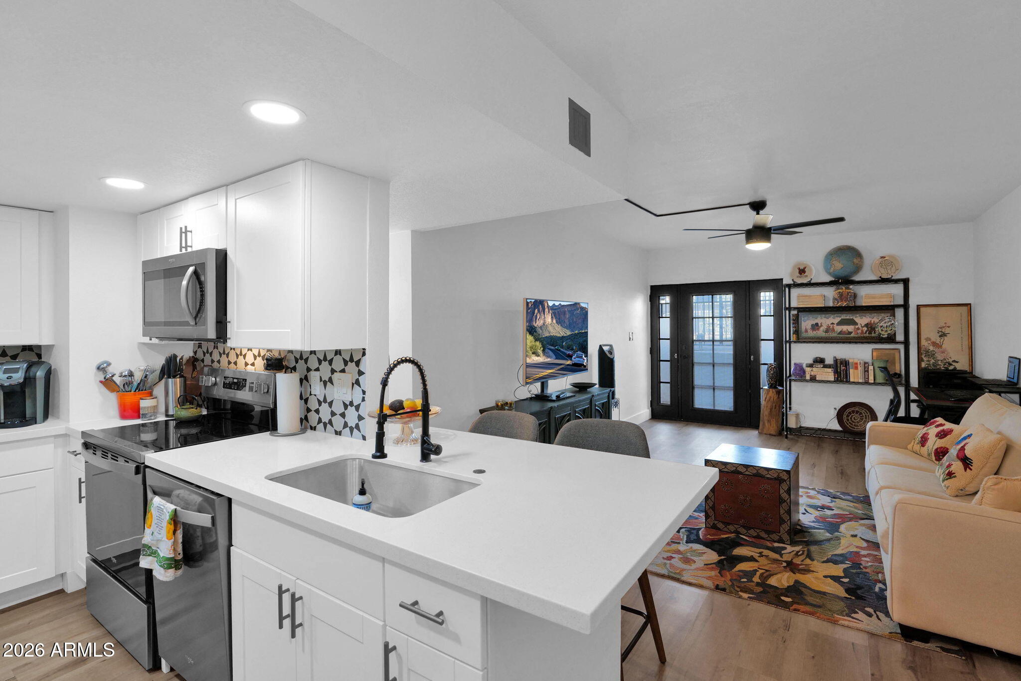 Fully remodeled Arcadia gem in the heart of one of Phoenix's most walkable neighborhoods. This stylish lock-and-leave residence is ideal for a traveling entrepreneur or business professional seeking comfort, convenience, and location. Offered fully furnished, with all primary utilities included in the HOA-this home makes everyday living effortless.  Enjoy a bright, updated interior with modern finishes throughout, plus access to the community's refreshing pool, perfect for a quick dip after a long day. Situated at the corner of 44th Street and Osborn, you're just moments from Arcadia's favorite restaurants, cafés, and hotspots. Turn-key, low-maintenance, and perfectly located, this is Arcadia living made simple.