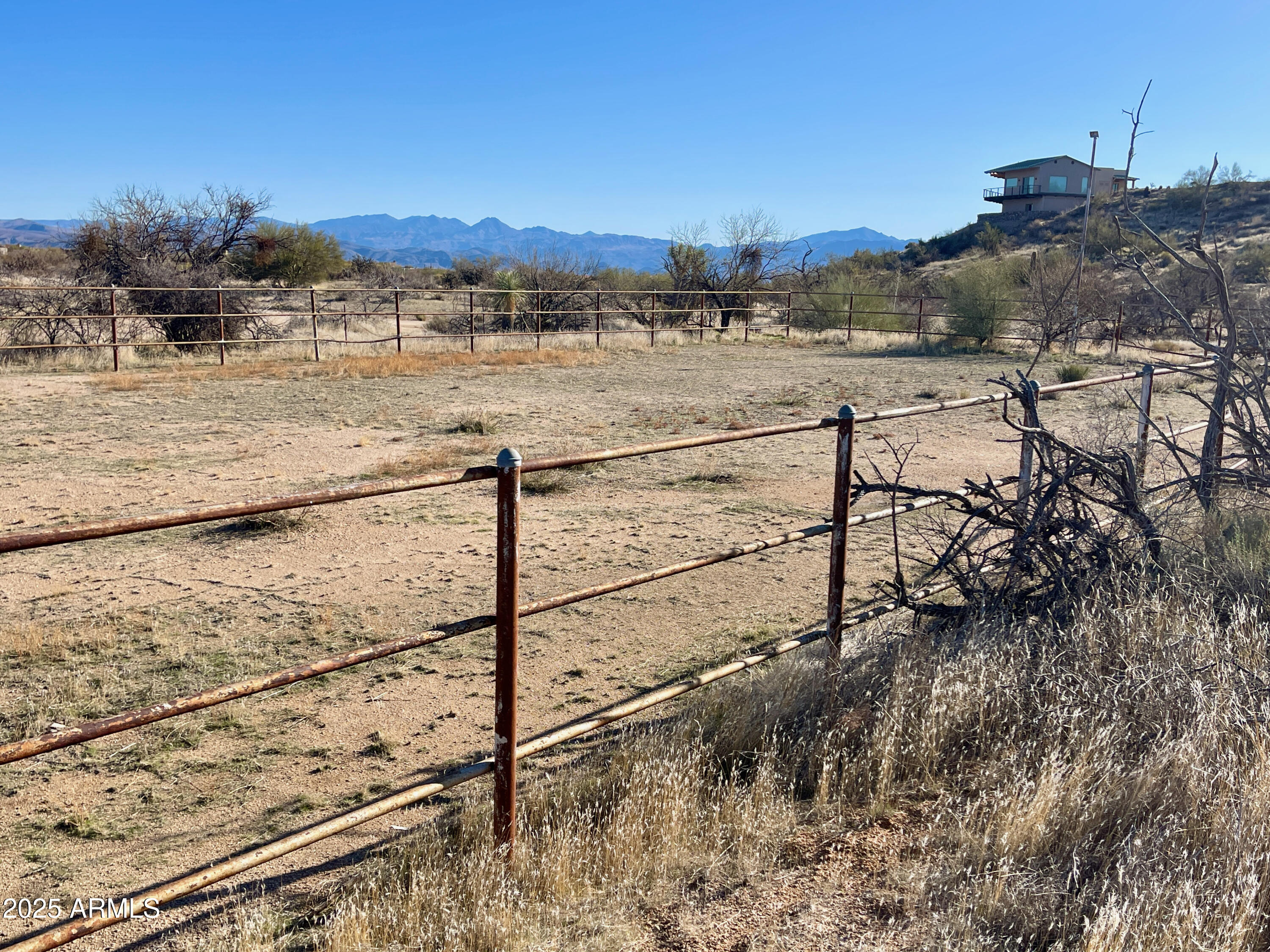 Experience the beauty of North Scottsdale from this 7.5-acre with breathtaking mountain views in every direction. Surrounded by homes on large parcels, this property offers the perfect setting for a luxury residence with an equestrian estate designed to be your special dream home.  Enjoy the privacy and tranquility of this prime location with no HOA restrictions. Nearby, Troon North Golf Club, McDowell Mountain Regional Park access, and Scottsdale's Preserve provide endless opportunities for outdoor recreation. Paved Rd to property.  Horse Corral on property.  Zoned R1-130, this land presents a rare opportunity for homeowners, investors, or developers. Walk the property and take in the incredible views—this is a must-see.