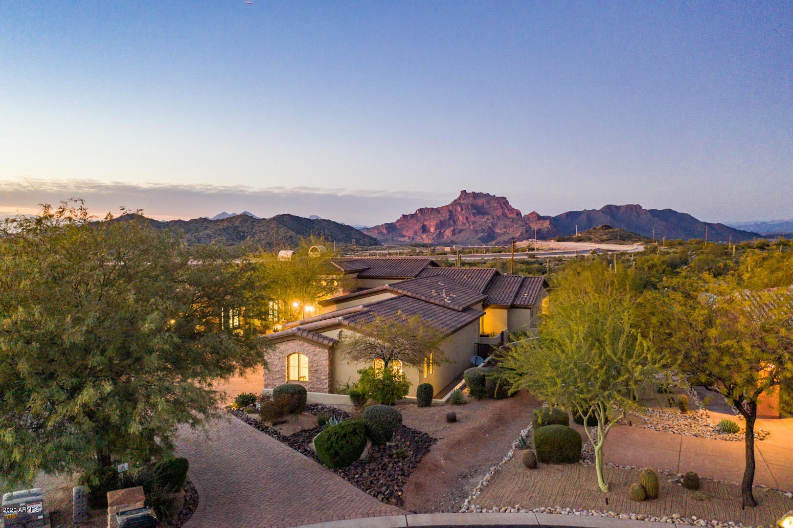 Exquisite entertainer's delight custom home with absolutely BREATHTAKING UNOBSTRUCTED views of the majestic Red Mountain framed in walls of glass AND stunning Sunsets. Nestled in the prestigious gated golf course community of Las Sendas backing to the natural desert w/miles of hiking/biking trails right outside your door GOLF MEMBERSHIP AVAILABLE Featured in the Phoenix Home and Garden Magazine this home boasts modern touches*architectural delights and dramatic light fixtures throughout. Chef's Gourmet Kitchen*top of the line Wolf Appliances*Double Ovens*Subzero Fridge/Freezer*Wine Cellar. Formal Living/Dining w/spectacular Fireplace. Master Suite w/luxurious Bathroom*his/her closets. Negative edge Pool/Spa*Built-in*BBQ*Fireplace*Everything in this home is exquisite and the highest quality