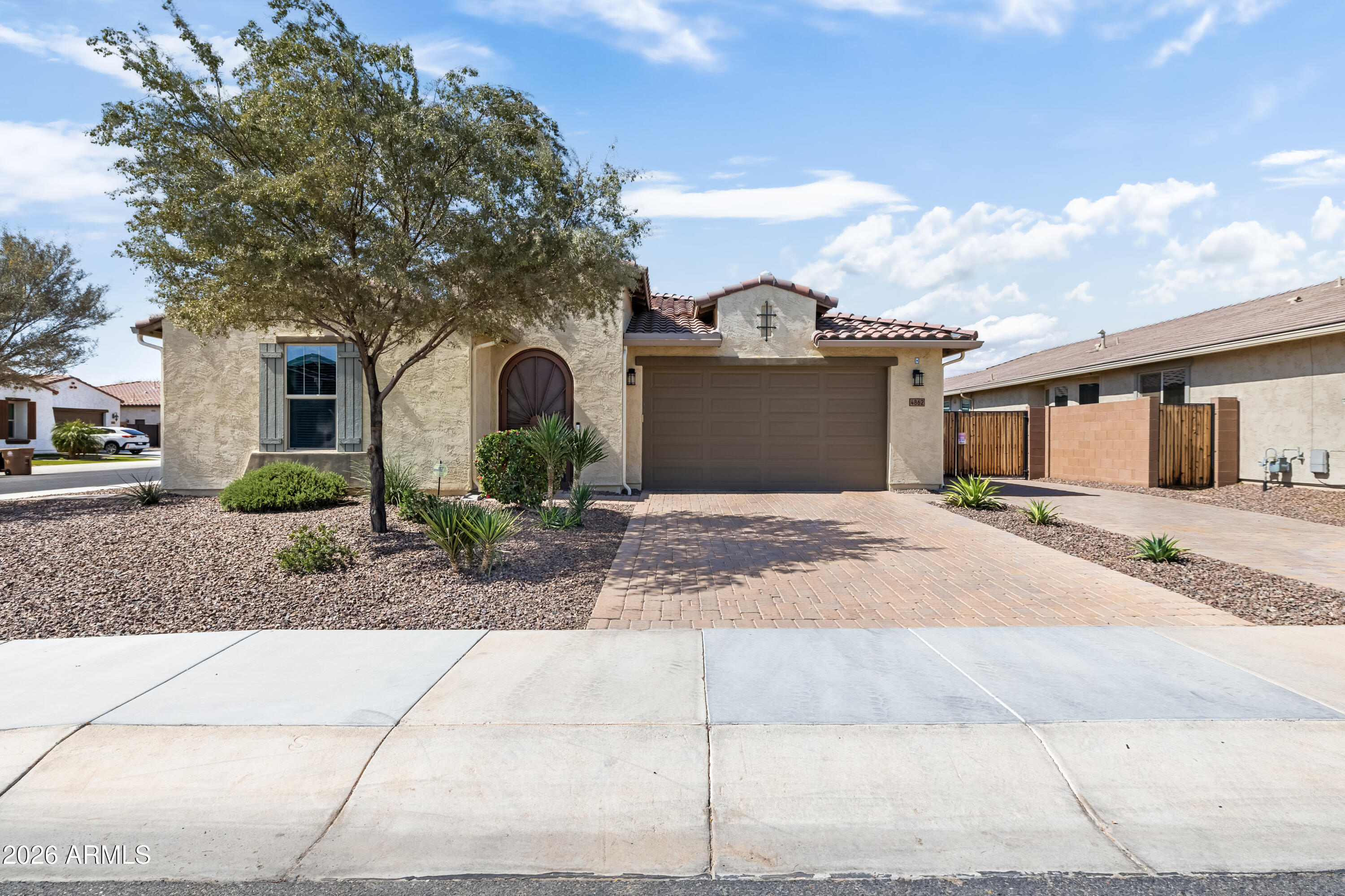 Resort style living with mountain views awaits in this beautifully upgraded single-story home in the desirable Sedella community of Goodyear. Built in 2019, this 4-bedroom, 3-bath home offers 2,414 square feet of living space that combines modern comfort, energy efficiency, and exceptional outdoor living.

The home welcomes you with attractive curb appeal and professionally designed low-water desert landscaping featuring decorative rock and native vegetation. Inside, the open floor plan creates a bright and inviting atmosphere with generous natural light and comfortable flow between the main living areas. The spacious great room connects seamlessly to the kitchen and dining space, making it ideal for both everyday living and entertaining. The kitchen offers an upgraded gas range, ample granite counter space and storage while remaining connected to the main living area so hosts can stay engaged with guests.

The spacious primary suite provides a comfortable retreat with plenty of room for larger furnishings and a private bathroom and walk-in closet. Three additional bedrooms provide flexibility for guests, a home office, or hobby space, while the three full bathrooms add convenience for both residents and visitors.

This home includes several valuable upgrades designed to enhance comfort and efficiency. Energy saving features include owned rooftop solar and spray foam insulation. A soft water system and reverse osmosis filtration system provide improved water quality throughout the home, while an automatic hot water circulating pump helps deliver faster hot water.

The garage is finished with epoxied floors, insulated garage doors, overhead storage racks, and a separate entry door, offering both functionality and organized storage.

A large 8-foot sliding glass door opens to the backyard, creating an easy indoor-outdoor living experience that takes full advantage of Arizona's sunny climate. The backyard continues to impress with its thoughtful design and low-maintenance landscaping. In addition to the pool and spa, the yard features a turf play area, shaded seating areas, and an 11.5' x 7.5' storage shed for tools and equipment.

For buyers with recreational vehicles or additional storage needs, the property includes an RV-ready side yard with a 12-foot gate and 30-amp hookup, allowing convenient access and flexibility.

Sedella is known for its scenic desert surroundings, walking paths, and welcoming community atmosphere. Residents enjoy convenient access to nearby shopping, dining, parks, and everyday services. Major roadways and freeway access are also close by, making commuting throughout the Phoenix metro area simple and convenient.

With modern construction, energy-efficient features, extensive upgrades, and a resort-style backyard, this Sedella home offers an outstanding opportunity to enjoy comfortable living in a desirable Goodyear location.