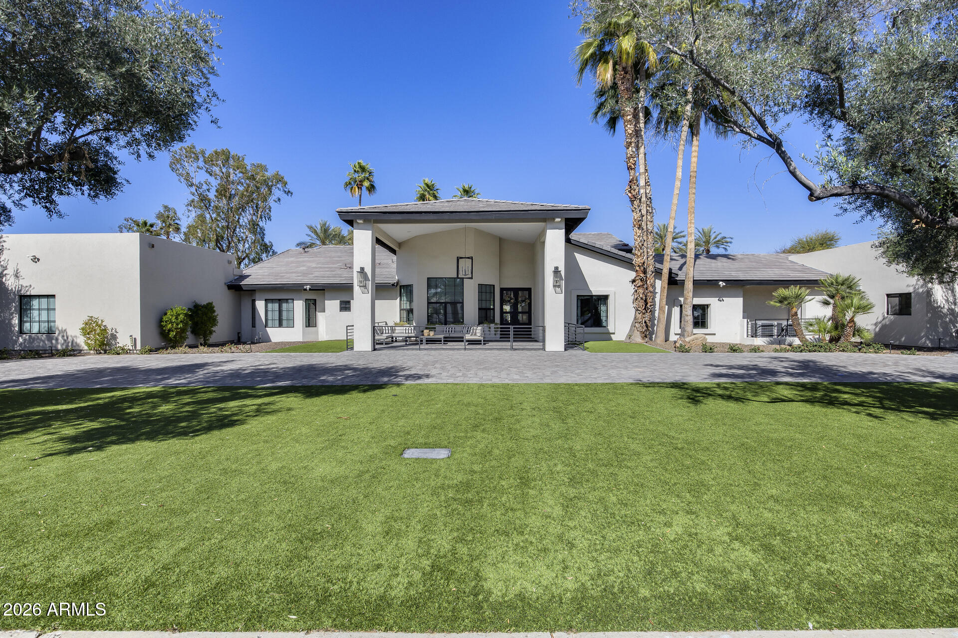 Stunning Fully Remodeled Residence  on .8-Acre No-HOA Lot in Coveted Stoneridge Estates - 
Discover this rare gem in highly desirable Stoneridge Estates, Scottsdale - a fully remodeled, move-in-ready residence offering nearly 5,800 sq ft of luxurious living space on a spacious 0.8-acre lot with mature landscaping. No HOA means freedom and privacy, just inside the 101 loop for effortless access to highways, premier shopping, dining, and a short walk to Northsight Park with its playgrounds, tennis courts, and green spaces. Zoned for top-rated Scottsdale Unified School District schools.
This exceptional home boasts 5 bedrooms + 5.5 baths, plus a separate 1-bedroom/1-bath casita ideal for guests, in-laws, or multi-generational living. A standout 5-car garage provides abundant parking and storage which is heated and cooled, complemented by an oversized RV driveway.
Every surface has been thoughtfully updated in the last 6 years, featuring fresh paint, new cabinetry, baseboards, PELLA windows and doors (with VIP lifetime warranty), stone fireplace, modern lighting, and durable wood-look tile flooring. Dual newer A/C units (2022 Day & Night variable speed) ensure year-round comfort.
The heart of the home is the expansive chef's kitchen with stainless steel VIKING Professional appliances (60" fridge, double oven, gas range, built-in microwave), massive eat-up island, two large pantries, and seamless open flow to a grand great room with soaring vaulted ceilings - perfect for entertaining. One secondary bedroom includes a spiral staircase to a private loft, ideal for guests or a college student.
The luxurious master suite offers vaulted ceilings, a cozy sitting room, well-organized walk-in closet, dual shower systems, and a freestanding tub.
Step outside to your resort-style backyard oasis: covered travertine patio, resurfaced pool (mini-pebble finish, baja step, waterfall, heater/cooler, removable fence), gas fire pit, spacious ramada with fan/lighting, high-pressure misters, BBQ area, expansive grassy turf (9,000 sq ft total low-maintenance turf front/back), and citrus trees. North/south exposure maximizes natural light and energy efficiency.
Major Upgrades Timeline:

2020: New insulated tile roof + foam roof, new electrical panel/subpanel, Pella windows/doors, pool resurface/pump/waterfall, travertine decking/ramada, gas fire pit, exterior smooth stucco (no repainting), dual water heaters, insulated garage doors w/ LiftMaster Wi-Fi, huge 19x9 storage attic, loop water system prep.
2022: Full kitchen remodel, new dishwasher, 2x HVAC units, pool fountain repair/reseal, removable pool fence, 9k sq ft turf, BBQ, misters/fans, electric blinds (bedroom/living), $50k+ landscaping, flat roof replacement, garage floor tiles, dedicated EV charger circuit, full automated sprinklers.
2023: New Wood tile floors, lighting, wallpaper, cabinetry and storage, exterior railing, 
2024: Permitted addition of attached 1 bedroom/1 bath casita and 2 oversized garage with 10 ft garage doors. New flat roof over master closet. 

New roof (2020), abundance of storage, and low-maintenance design make this a truly turnkey luxury retreat in one of Scottsdale's most sought-after pockets. Don't miss this exceptional opportunity!