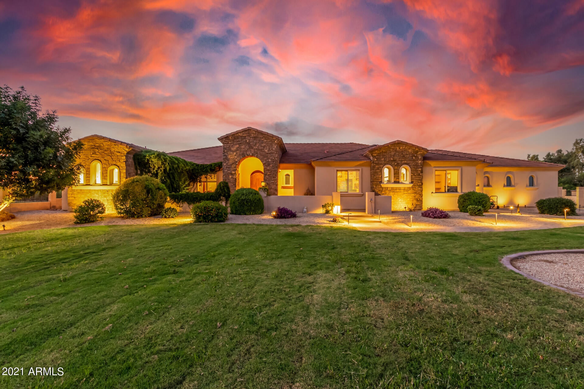 Custom home & horse property on just under 2.5 acres. Not many horse properties located in this location with irrigation. Large pasture for your livestock. 5 Covered Horse stalls with a tack room and bathroom. The home features wood plank tile floors, impressive fireplace, upgraded ceiling fans, recessed lighting, & a warm palette. Architecturally & aesthetically pleasing through out. Stunning gourmet kitchen features a plethora of custom wood cabinets, granite counters, pendant lighting, SS appliances, walk in pantry, tile backsplash, & an island w/a breakfast bar. Beautiful travertine floors in all bedrooms, large walk-in closets, & upscale baths. Home backs to Queen Creek wash with access to the walking path that goes for miles and miles.