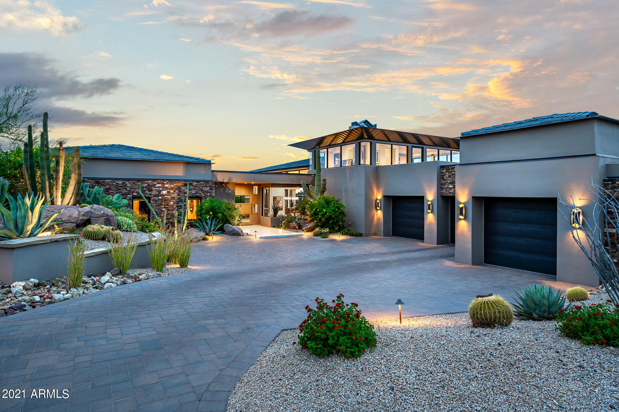 State of the art construction designed by Craig Wickersham, AIA with wide open and dramatic contemporary floor plan in the prestigious community of Estancia * South-facing backyard with views of Pinnacle Peak from main living areas * This property features 3 guest suites, open kitchen to family room, dining on main level with private office upstairs * Thoughtful architectural design with an abundance of natural light and exceptional custom finishes throughout *