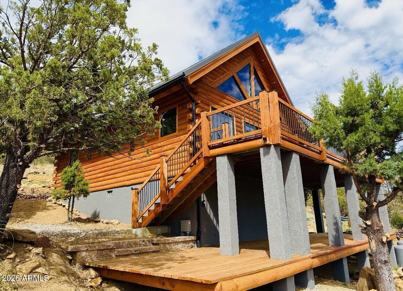 Welcome to your little slice of heaven in the Bradshaw Mountains.Just two hours from Phoenix, this stunning two-year-old cabin was built from the ground up on a private 2-acre lot -- with breathtaking views of the valley stretching out below. Surrounded by pines and wide-open skies, you'll have every comfort of home at your fingertips. The open floor plan with loft, Low E dual-pane windows, and all-stainless steel appliances make this feel like a true retreat. Step outside onto the expansive decks for your morning coffee, evening sunsets, or simply some well-earned front-porch sitting.Plenty of room for entertaining, BBQ's or Picnic's. With 2 bedrooms and 1.5 bathrooms, this fully turnkey property lets you escape the desert heat in summer and wake up to fresh mountain snow in winter.