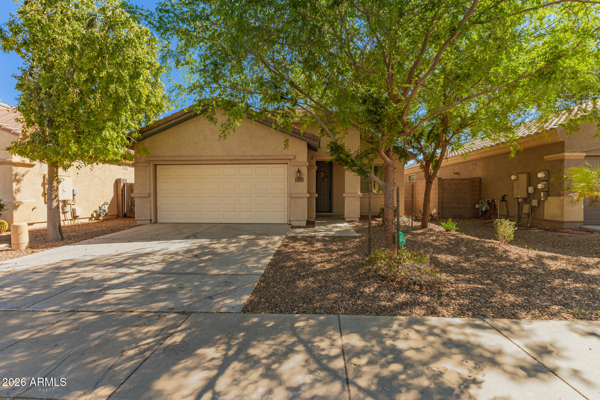 Beautiful Move-In Ready Solar Home! Enjoy a free solar system for your comfort and enjoyment.  Inside, you'll be greeted in sizable living areas filled with natural light, showcasing tile floors, plantation shutters, and neutral paint that works great with any decor style. The impeccable kitchen is a chef's delight, offering plentiful storage cabinetry, Granite countertops, lots of counter space, and an island, perfect for meal prep and entertaining. The main retreat features a private exit, a bathroom, and a walk-in closet for effortless organization. Get ready for weekend grills and peaceful evenings in the backyard, complete with a cozy covered patio and ample seating space with an easy-care desert landscape. Hurry up, this gem won't last!