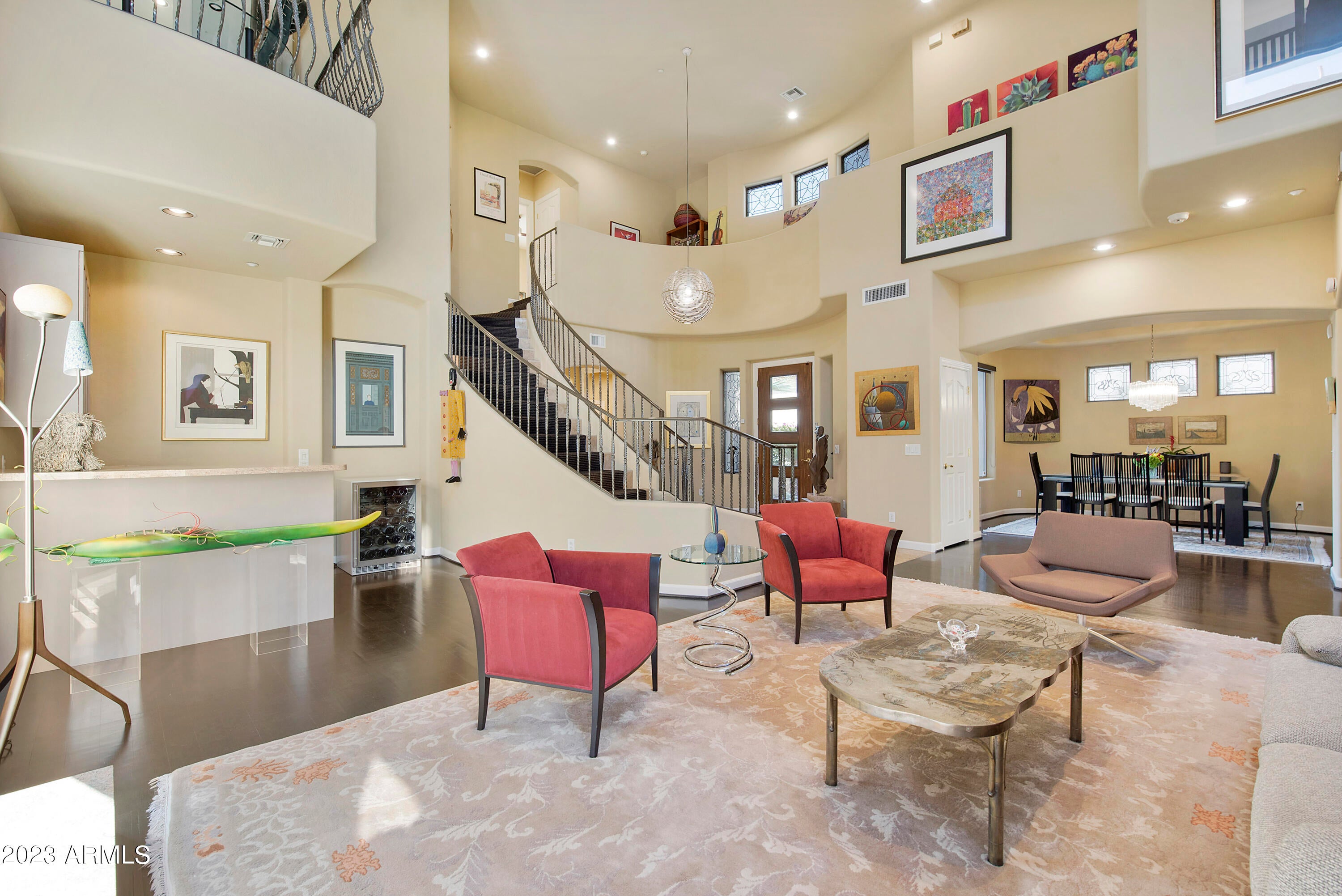 This impeccably renovated villa offers a luxurious, modern resort lifestyle in convenient guard-gated Gainey Village Villas. Through the elegant gated front courtyard, step inside the grand foyer to soaring ceilings and abundant light in the great room with updated granite fireplace and bar area. The remodeled contemporary kitchen, featuring Woodmode cabinets, stainless steel appliances and quartz countertops, opens to a breakfast room bathed in sunlit windows, and a cozy den. The spacious upstairs primary bedroom with beautifully redone custom bath is split from the other two bedrooms and has a large walk-in custom closet. Two additional bedrooms are joined by an ensuite Jack and Jill bath. An additional office/4th bedroom is downstairs, with a full hall bath, to easily host winter visitors! Cozy up to the outdoor kiva fireplace and grill and dine alfresco in the private manicured yard, all with a hard-to-find 3-car garage! A must-see home in Gainey Village, where world-class restaurants and shopping are but a short walk away!