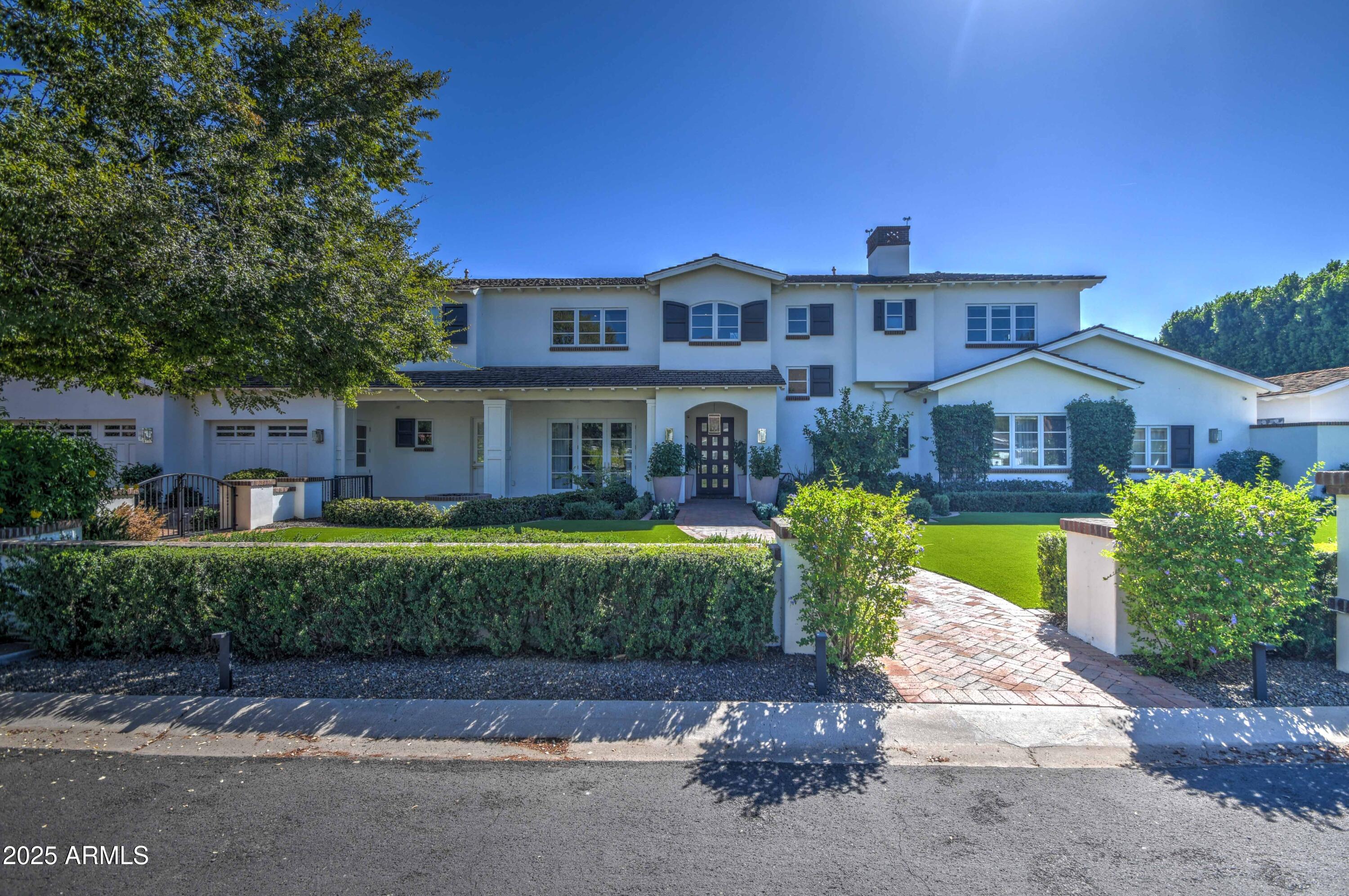 This stunning estate located in the heart of Arcadia perfectly defines luxurious comfort. Loaded with character, room after room has unique custom chic design elements. From the moment you arrive, it's obvious that this is someplace very special with its fantastic curb appeal that leads to an elegant foyer and into a home that fuses upscale architecture and bold design choices. The exquisite kitchen features an oversized island with more than enough room to prep and serve, 3 ovens, 2 soapstone sinks, 2 dishwashers, a large built-in wine fridge, ice maker and big custom pantry. The meticulous living spaces include a magnificent great room, opulent dining room, music/playroom, 5 ensuite bedrooms and 8 baths, including an absolutely dream worthy primary retreat with a spa like marble covered bath and 2 custom closets that are built unlike any other. The grounds are truly spectacular and offer fun for all generations with a fabulous pool and spa, gazebo with outdoor kitchen, bocci ball court, 5 hole putting green, 2 fireplaces, and covered and uncovered patios that offer excellent spaces for al fresco candle lit dining. Not to be overlooked are the workout room and golf simulator. The lavish finishes are too numerous to name, yet include pristine wood flooring, designer decorative lighting, exceptional millwork, custom tongue and groove ceilings, and upscale fixtures that perfectly accent every room. This stylish home is the epitome of refined luxury!