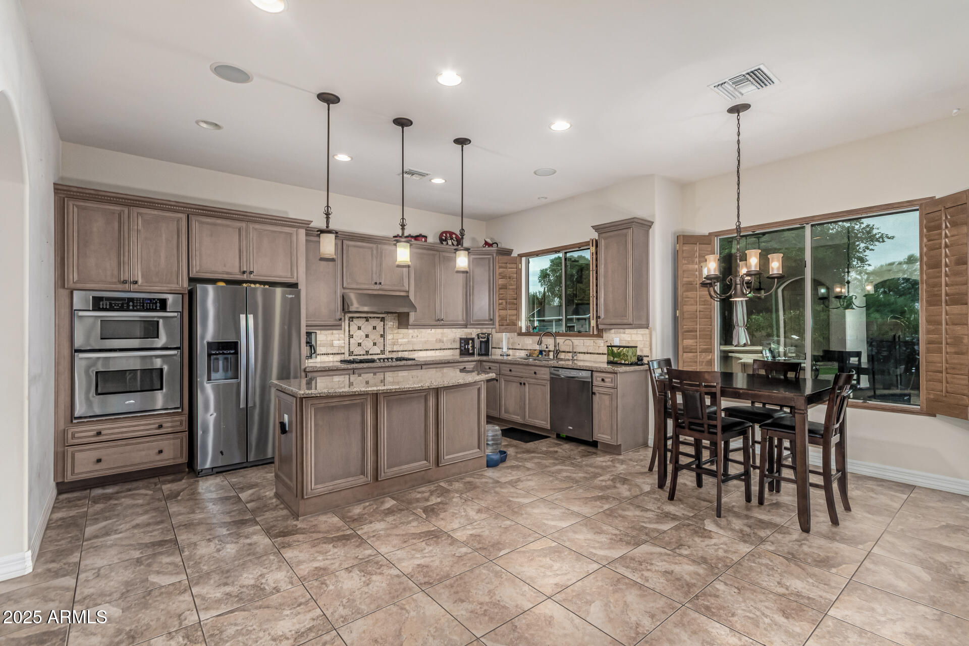 Opportunity to live in the exclusive gated MonteVista community in Cave Creek! Spacious home features 4 bedrm + bonus theater-game-playroom upstairs & additional bonus room-office downstairs. Enjoy an inviting interior courtyard, a lush backyard w/gas heated pool & spa, built-in BBQ. citrus trees & rose bushes. Large kitchen boasts SS appliances, 5-burner gas cooktop, blt-in Brew Express coffee maker, wine cooler, R/O system, center island open to great rm with stunning Canterra stone gas fireplace. Elegant entry showcases a rotunda w/connected sitting area, formal dining room, plantation shutters throughout. Additional highlights include a tandem 3-car garage w/epoxy flooring, 2 4X8 overhead storage units, exit door to back.  Just steps to the community park. Rentals Allowed with 30 day min lease.

$75,000 in Interior Builder Upgrades:

Wood plantation shutters t/o 
Cantera stone gas fireplace in great room.
Sunken bonus room with French doors, built-in adjustable custom wood shelving & cabinets with Home Theater Control 4 systems.
Upgraded kitchen cabinets, custom beveled granite, undermount sink, fixtures, wine chiller, custom backsplash, lighting under cabinets, RO.
Marble countertops in Primary.
Upgraded lighting for art niches, floor lights along stairs & hallway, canned ceiling  lights on dimmers t/o.
Upgraded custom iron stair banister and smooth Santa Fe texture.
Classy closet shelving & lighting upgrades inside all bedroom closets.
Full height mirrors framed in tile in bathrooms.
Triple Low E windows.
RO system

$115,000 in Exterior upgrades:

Resort heated pool & elevated Spa with overflow cascading over rock into pool, Pebble-Tec finish, Baja shelves, pop-up cleaning system, flagstone trimmed pool & spa.  Variable speed Hayward pool filter with valve to separately heat the spa. 
Flagstone lined walkway and private courtyard.
Landscape lightning & drip system in front, courtyard and back on timers
Built-in BBQ & flagstone table.
Turf backyard
Epoxy garage coating, 2 8X4 overhead storage shelves, separate man door exit
Extended garage & patio
Upgraded aggregate concrete driveway.