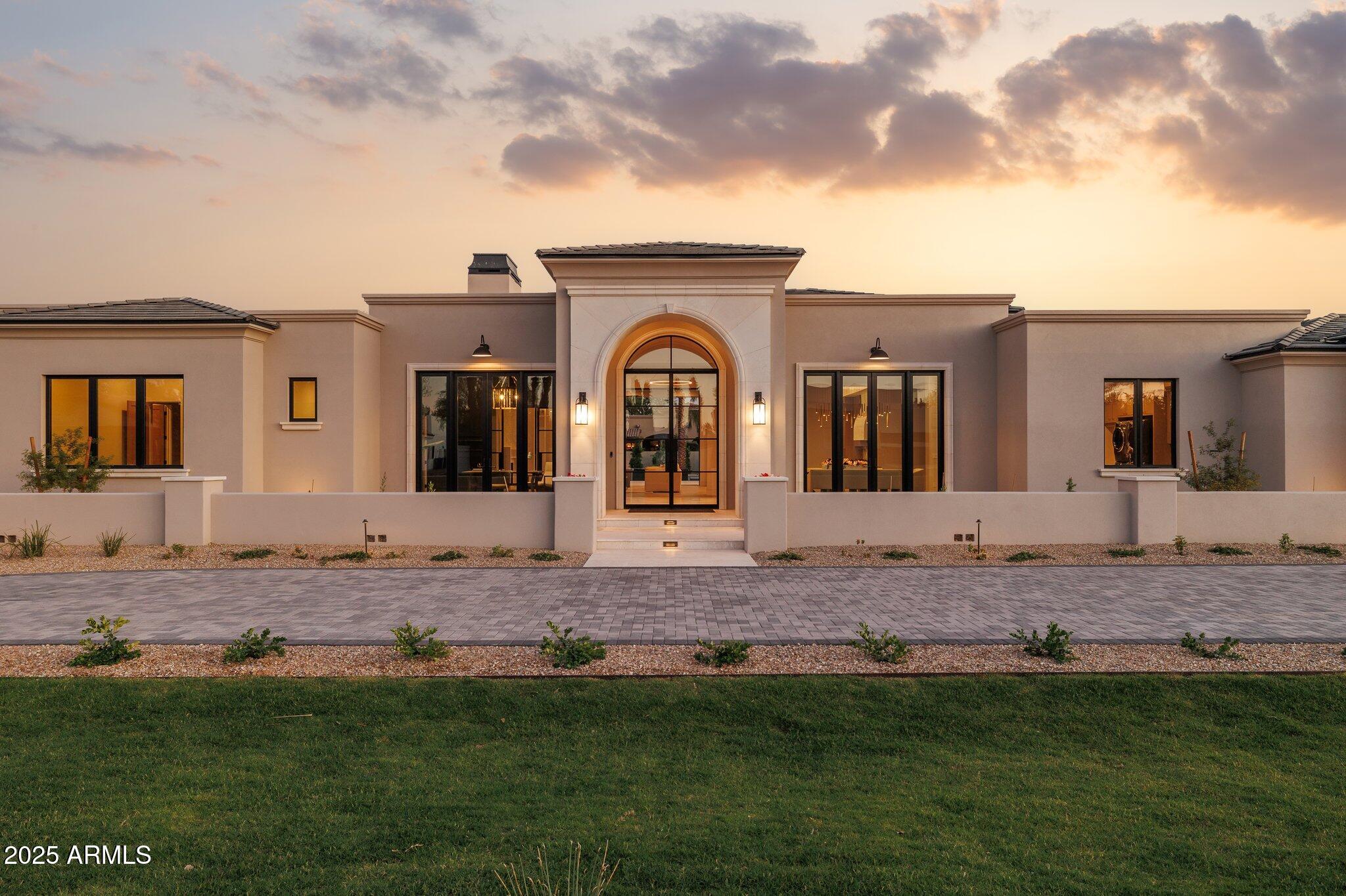 Introducing 6633 E Horseshoe Road—a newly completed stunning estate in Paradise Valley. Located on a full acre, this 7,834 SqFt property includes a 6,595 SqFt main house with four en-suite bedrooms, a dedicated office, formal dining room, temperature-controlled wine display, game room, and a secondary prep kitchen tucked behind the main kitchen. Large glass wall pockets to connect the interior custom pool, spa, and outdoor kitchen. An indoor/outdoor bar extends from the game room to the patio, creating an effortless flow for entertaining.

The detached 1,239 SqFt Guest House includes 1 Bed/1 Bath, full kitchen, and living area—ideal for long-term guests or extended family. A five-car garage and motor court accommodate both daily use and event parking. Every space was built with purposenothing feels overdone, and no detail was overlooked. This is modern design with lasting appeal, in one of the Valley's most established neighborhoods.