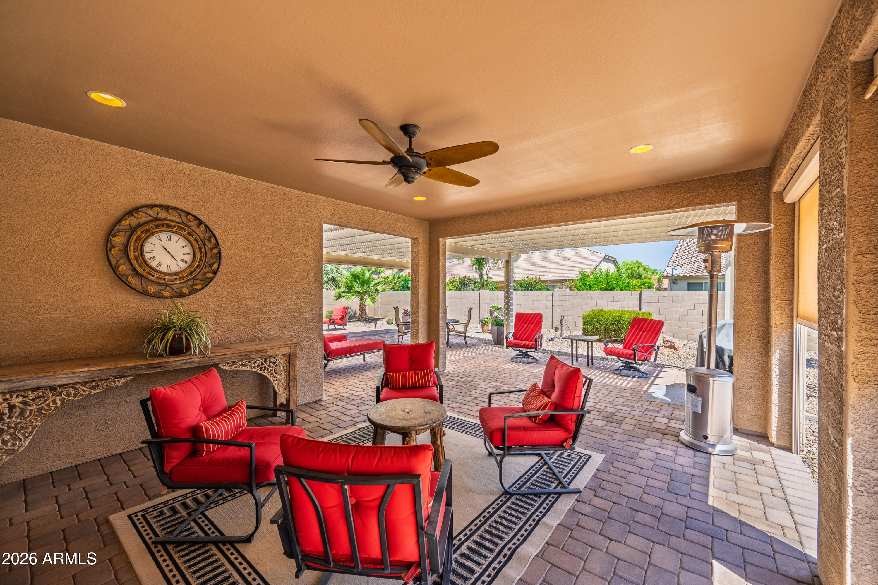 Exceptional Merano model is available partially furnished.  Also features a stunning patio pergola, perfect for entertaining and outdoor living. The deluxe kitchen is thoughtfully designed with built-in oven and microwave, a pantry, quartz countertops, and a 5-burner gas cooktop. The spacious primary suite includes a large bedroom extension and dual walk-in ''his and hers'' closets.  
Additional highlights include a private guest suite with a full bath and oversized closet, as well as an expanded 2.5-car garage with an additional 4-foot extension for extra storage or workspace. The home also features a new 5-ton HVAC air conditioning unit for enhanced comfort and efficiency. This home truly offers exceptional space, style, and functionality. See attached list of extras and furniture incl.