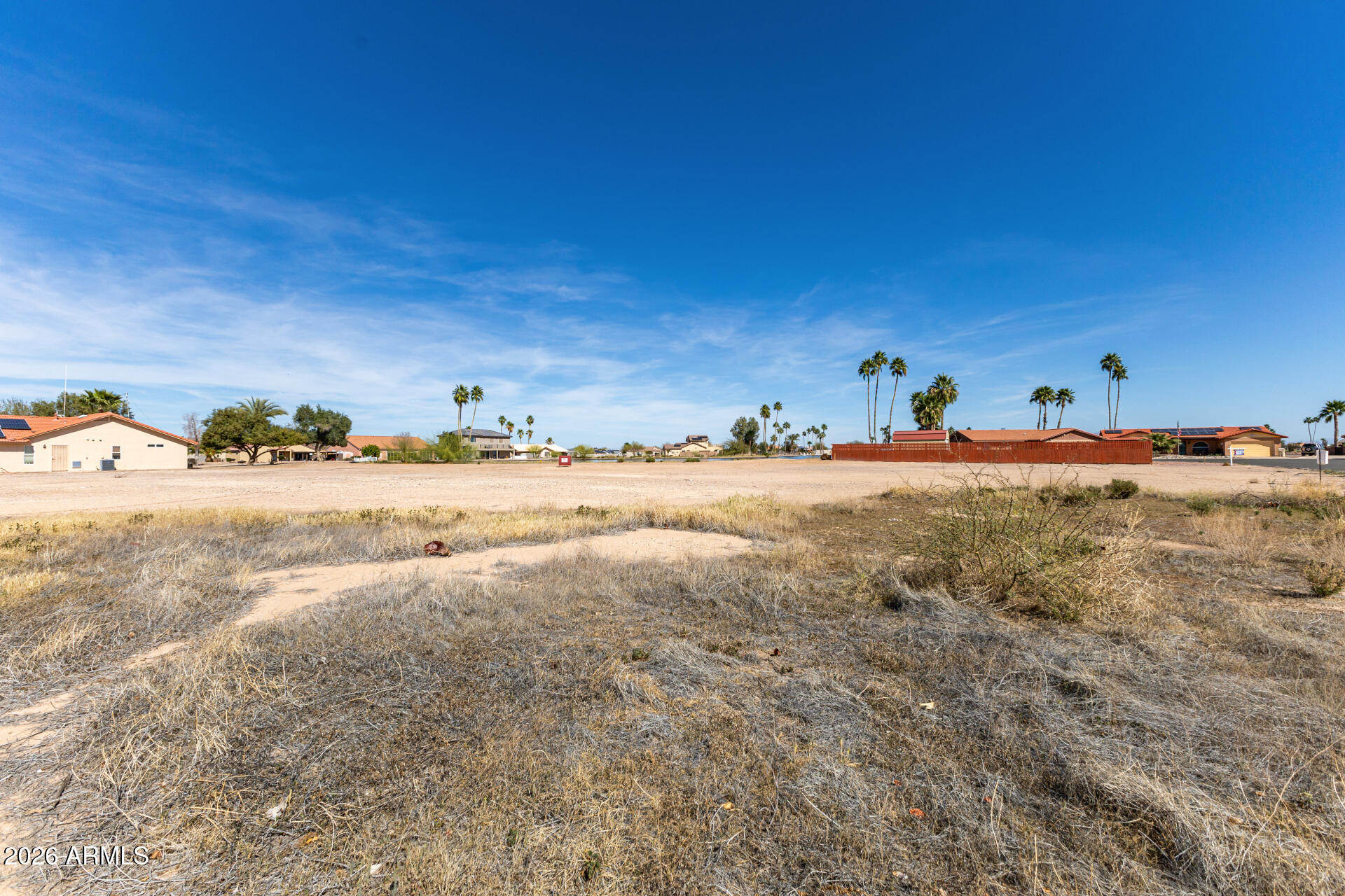 Build your dream home on this nearly 1/4-acre waterfront lot! Positioned along the water with lake-length views, this homesite offers a rare combination of open water scenery, mountain views, and Arizona's signature sunrises & sunsets - all from your own backyard. The lot provides ample space for a custom home, whether you envision expansive windows facing the lake, a covered patio for outdoor living, or a layout that fully maximizes the views. Located within a lake community, you'll enjoy the unique setting of water-oriented living while remaining close to everyday conveniences. Properties offering this much lake exposure at a comparable price are increasingly hard to find! Don't miss this opportunity!