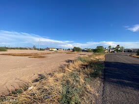 Large lot zoned R-3, Build a single family home or multi-unit investment property.  Build up to 3 units.  Paved roads, utilities in the alley. APS Electric - City of Eloy water and sewer.