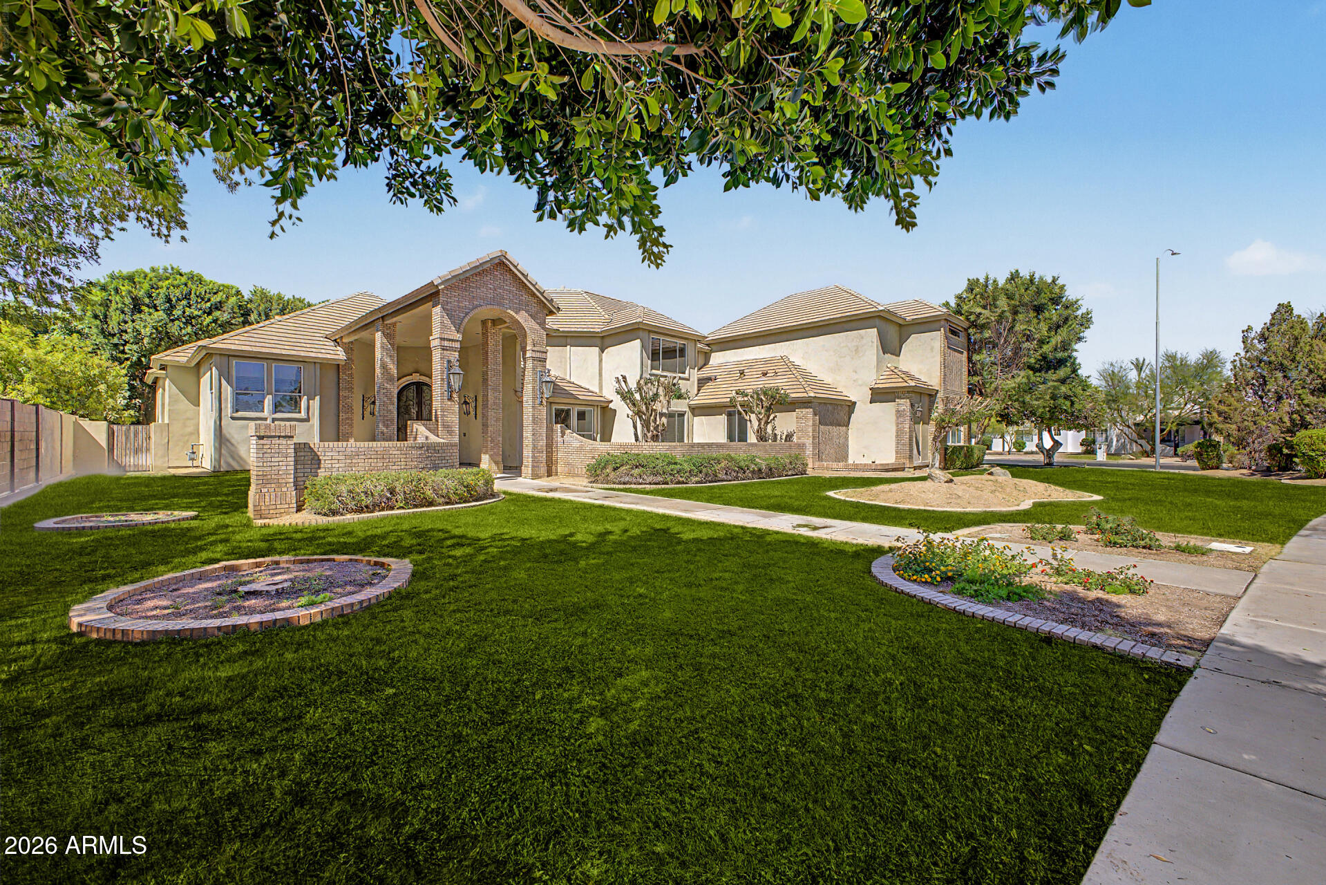 Expansive and beautifully designed, this 5-bedroom, 6 full and 2 half-bath estate offers 5,710 sq ft of exceptional living space, ideal for both everyday comfort and unforgettable entertaining. From the moment you enter, you're welcomed by a grand foyer and elegant sitting area that set the tone for the home's spacious and versatile layout.
Multiple flexible rooms provide endless possibilities, including spaces perfect for a home office and a dedicated fitness room. The main living area features a warm and inviting fireplace, while the generously sized kitchen is equipped with a large island, abundant cabinetry, and a walk-in pantry to meet all your storage needs. The private primary suite is thoughtfully positioned on its own level, creating a true retreat with dual vanities, a soaking tub, separate shower, and expansive walk-in closets. Additional bedrooms, each with access to bathrooms, are well-appointed across both levels of the home. Entertainment continues with a large game/media room, perfect for gatherings or relaxing nights in. Step outside to a resort-style backyard complete with a sparkling pool, oversized covered patio, and ample space to host and unwind. An RV gate and parking add convenience and flexibility to this impressive property.