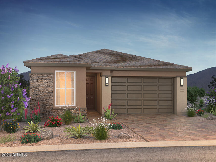 **PHOTOS ARE OF THE FLOURISH MODEL IN ANOTHER TRILOGY AZ COMMUNITY**Welcome into this beautiful Flourish designer home with 1818 sq  ft, featuring 3 bedrooms, 2 bathrooms, a fully landscaped yard and paver driveway. The spacious kitchen is a standout, offering 42'' upper woodcase shaker style cabinets, polished quartz countertops, a quartz island and 3x12 white horizontal brick set tile.  LED undercabinet creates a light and bright atmosphere that opens seamlessly into the great room with impressive multi-slide doors. Step outside and unwind in the thoughtfully landscaped backyard. Perfect for relaxing and entertaining. This home has hard surface flooring throughout and fully tiled showers and is equipped with a soft water system as well as an RO system with Pre-pluming included. Shea Homes Marketing Company (AZ DRE #CO550381000). Construction: Shea Homes Limited Partnership (ROC #195895). SHAZ GC, Inc. (ROC #327019). This is not an offer for real estate for sale, nor solicitation of an offer to buy to residents of any state or province in which registration and other legal requirements have not been fulfilled. A PUBLIC REPORT IS AVAILABLE ON THE STATE REAL ESTATE DEPARTMENT WEBSITE. Pricing does not include options, elevation, or lot premiums, effective date of publication and subject to change without notice. All square footages and measurements are approximate and subject to change without notice. Trademarks are property of their respective owners. Equal Housing Opportunity.
