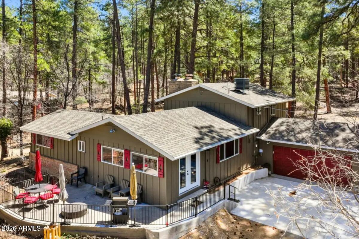 Unique real estate opportunity in the historic community of Groom Creek. This property is situated on 1.2 secluded & treed acres in the woods, yet it remains just 15 minutes away from Courthouse Plaza, Whiskey Row, & the shopping & dining of downtown Prescott. Seasonal creek runs through the property.This estate includes a 3 bedroom, 2 bathroom main house and a 2 bedroom, 1 bathroom guest house. Both have been recently updated with new roofs, new windows, new kitchens, new bathrooms, and new air conditioning & heating systems.  Large outbuilding. Excellent access to the scenic beauty of the Prescott National Forest, including miles of hiking & biking trails and Goldwater Lake. For added peace of mind, the property is located 1/2 mile from the Groom Creek Fire Station. Swingset not included