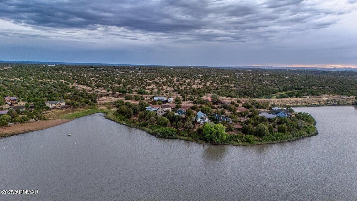 Lakefront Living in Show Low - 105 Feet of Waterfront Bliss Wake up to sunrise views and lakeside serenity at this charming 2-bed, 2-bath home on 105 feet of private shoreline in Show Low, AZ. Enjoy one of the area's few power-sport-friendly lakes--perfect for jet skiing, wakeboarding, and boating--right from your backyard. Inside, natural light fills the open living space, with large windows framing stunning water views. The home includes two spacious bedrooms, an office that can serve as a third, and a versatile Arizona room ideal for relaxing or entertaining. A peaceful walking path leads to the water's edge, and the east-facing porch offers the perfect spot for morning coffee and golden sunrises. Whether it's your full-time home, weekend escape, or investment, this

lakefront retreat blends tranquility, recreation, and unmatched beauty--all with 105 feet of shoreline to call your own.