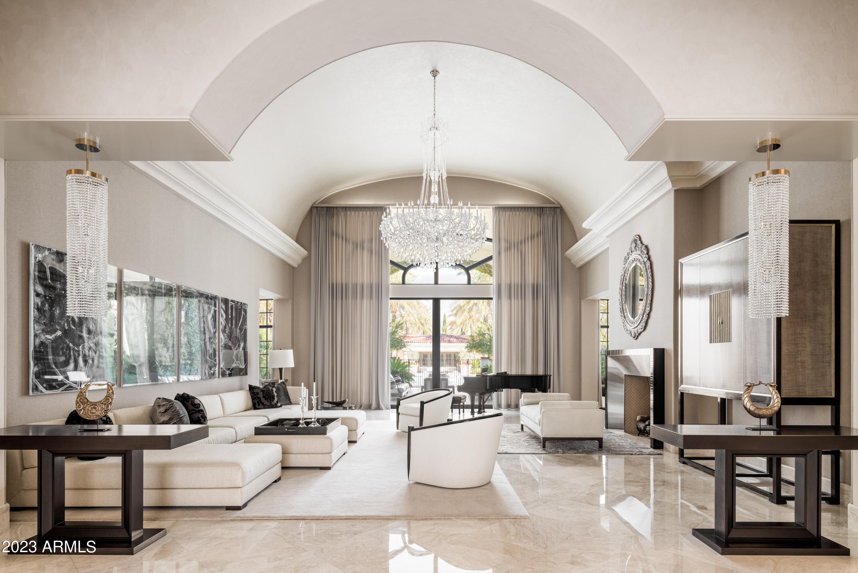 Your own Private Luxury Resort! 18,575 sq ft estate on 5 ACRES w/ absolutely exquisite finishes and $4.5 million in upgrades completed in 2015. This SINGLE LEVEL residence has 21 ft ceilings, 2 swimming pools w/ 75ft lap pool, 2 libraries w/ elegant Pierre Langue mahogany millwork + leather floor, 14 seat mahogany theater w/ glass ticket booth, 2 parlor bars + wine rm, huge exercise rm, luxurious master suite w/ floors of 7 ft slabs of marble + 2 huge closets w/2 elegant bathrms + 1,850 sqft 2 bdrm guest house! A chef's white kitchen opens to a large family rm w/ white hickory floors. VERY PRIVATE w/ fabulous mature landscape.GARAGES FOR 30+ CARS and a jaw dropping SHOW GARAGE. Motorcoach + Show Garage double as family activity rooms perfect for year-round-play + entertaining. Home was remodeled + updated by noted designer Michael Ferguson. Show Garage features 5 vintage gas pumps, photos of 1932 airplanes on interior garage doors, red+silver checkered floors+red lacquered cabinets! 8,000 sq ft of covered patio for entertaining. Estate has 4 layers of trees for privacy at the front. The estate is a fully equipped Savant system + additional security cameras.