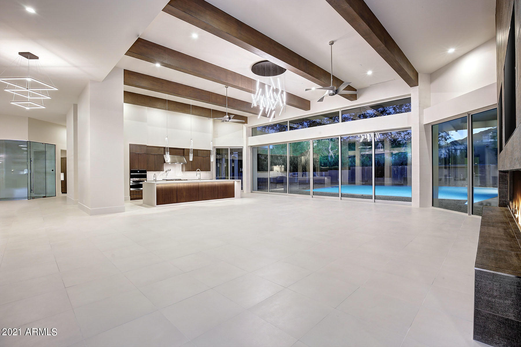 New Modern Contemporary  Residence with Completion June 2021.  Interior complete now! Breathtaking panoramic views of Camelback and Mummy Mountains.  Prime platinum location in the heart of Paradise Valley.  Exquisite design with timeless tasteful finishes creating a spectacular place to call home.  Soaring ceilings up to 16 feet with full walls of glass to take in the natural beauty of the site & iconic Camelback Mountain.  Sound-proofed Theater room, extra large guest suites, Resort sized pool complete with walls of fire, water and a huge spa.  Guest House with own garage, one bedroom, laundry & full kitchen.   Privately gated at the end of a cul-de-sac.  Best location of all available new builds in PV!