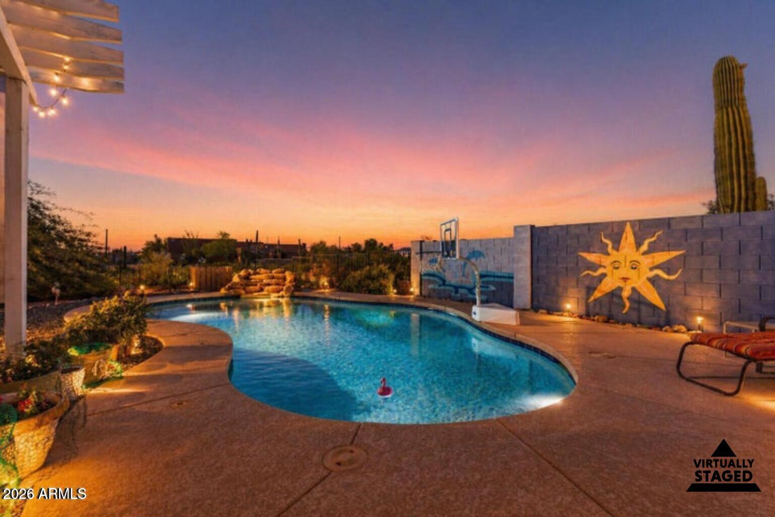 Come live the Arizona lifestyle you've been dreaming of.
Set on over half an acre with no HOA, this beautiful custom home delivers wide-open space, peaceful surroundings, and jaw-dropping views of the Superstition and Goldfield Mountains. Step outside to dark skies, quiet evenings, and direct access to the kind of outdoor living Arizona is known for—hiking, off-road riding, trail exploring, and nearby lakes, all just minutes away.
The fully fenced property offers privacy, room for your toys, and true freedom, complete with RV parking, hookups, dump, and dual RV gates. Whether you're storing off-road vehicles, boats,  or trailers, there's space to spread out and make it your own. Inside, the home welcomes you with an open, airy floorplan, high ceilings, SEE MORE Tab a soothing color palette, and wood-look tile plank flooring throughout. The kitchen anchors the space with granite countertops, stainless steel appliances, recessed lighting, crown-molded cabinetry, a pantry, and a large island with breakfast bar, ideal for both everyday living and entertaining.
The split floorplan includes 3 bedrooms and 2 bathrooms, highlighted by a spacious primary suite with a large walk-in closet and a remodeled ensuite featuring dual sinks and a beautifully tiled walk-in shower.
Out back, take in the mountain views from your own resort-style oasis. Enjoy a sparkling pool with water feature, covered patio, gazebo, and a built-in outdoor kitchen/BBQ with dry bar-perfect for sunset evenings, weekend gatherings, or relaxing after a day on the trails. A large detached shed/workshop adds endless potential as a future pool house, hobby space, studio, or additional storage.
Additional features include a whole-house water filtration system, AZ Water Service, and strong short-term rental potential thanks to the views, land, pool, and location.
Peaceful. Private. No HOA. Mountains, trails, and freedom at your doorstep.
This is Arizona living - come and get it.