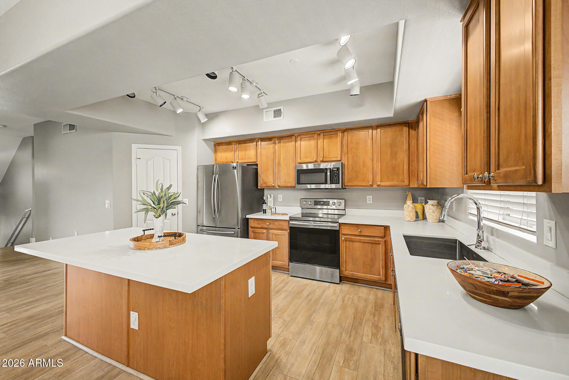 Welcome to this beautifully designed three-level condo overlooking one of the communities two sparkling pools. Offering both privacy and functionality, this home features a versatile layout perfect for modern living. Gorgeous bright kitchen with stainless-steel appliances, stunning counters, walk-in pantry, breakfast bar, and plenty of space for gatherings, creating the perfect setting for entertaining or relaxing. Upstairs bedrooms provide a peaceful retreat with separation from the main living spaces. Residents of the community have access to two sparkling pools, multiple playgrounds, a Ramada and a BBQ area, and enjoy close proximity to shopping, dining, and everyday conveniences. Located within a highly sought-after neighborhood known for its top-rated schools, this property offers an exceptional blend of comfort, convenience, and lifestyle.
