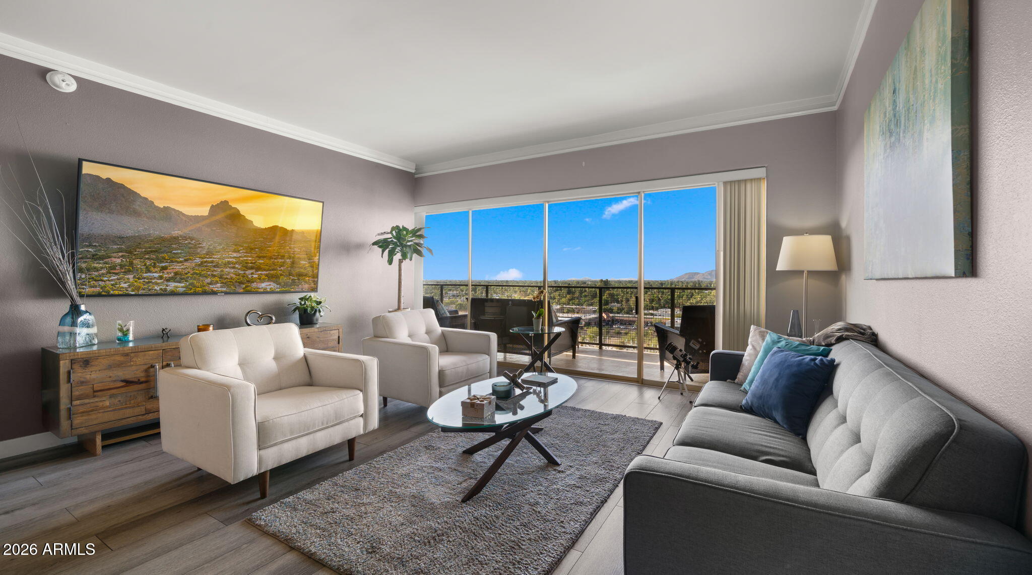 Experience elevated urban living at Landmark Towers. This updated 11th-floor north-facing residence offers sweeping 180° Valley views from a full-length private balcony. Interior upgrades include luxury cork-backed wood plank flooring, fresh paint, and updated kitchen and baths, creating a clean, modern, move-in-ready retreat. Landmark Towers has recently completed major improvements including new balconies, roof, elevators, refreshed sky lounge, and new hallway carpeting throughout. Enjoy 24-hour front desk service, secured entry, utilities included, and 2 underground parking spaces. Amenities include a heated pool, fitness center, theater, rooftop sky lounge, club room, library, and business center. HOA includes Wi-Fi, cable, heating, cooling, water, sewer, and trash.
