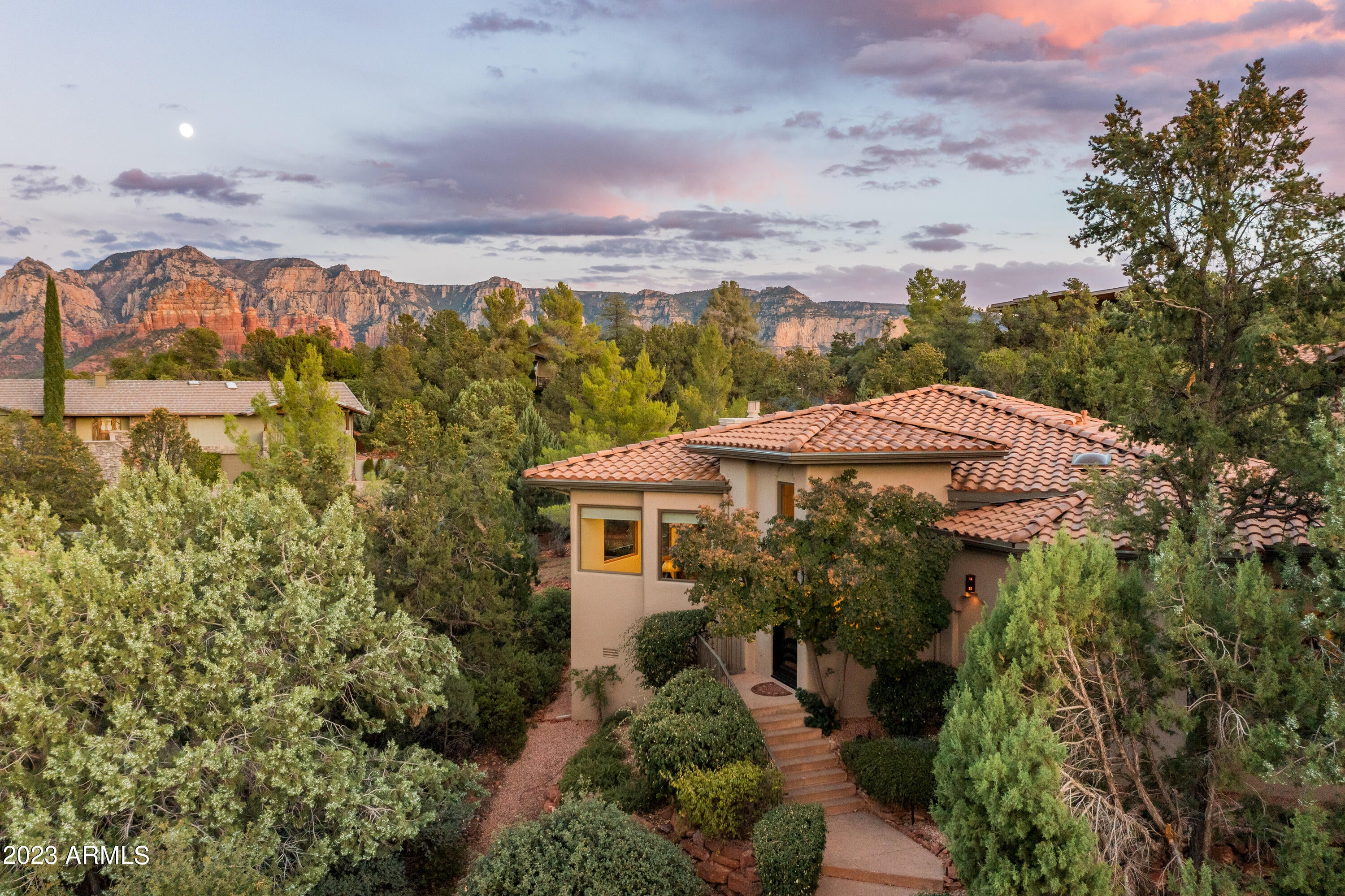 Welcome to your exquisitely single level remodeled 3BD/3BA gem in a gated community, where luxury meets tranquility. Most furniture & some art available! Red Rock panoramas from the deck complemented by a motorized awning for shade. The heart of the home unfolds in a newly remodeled gourmet kitchen featuring an enlarged Quartz site-topped Island, custom soft-close cabinetry, state-of-the-art Wolf appliances, and a white subway tile backdrop. Family room is adorned with custom wood built-ins, a new modern gas fireplace,  LED lighting, and luxury motorized silhouette shades. Premium upgrades are evident throughout, from a bespoke iron front door, Anderson windows, and a new Lennox HVAC system. Les Springs offers a clubhouse, swimming pool, tennis, and pickleball! Upgrade list available.