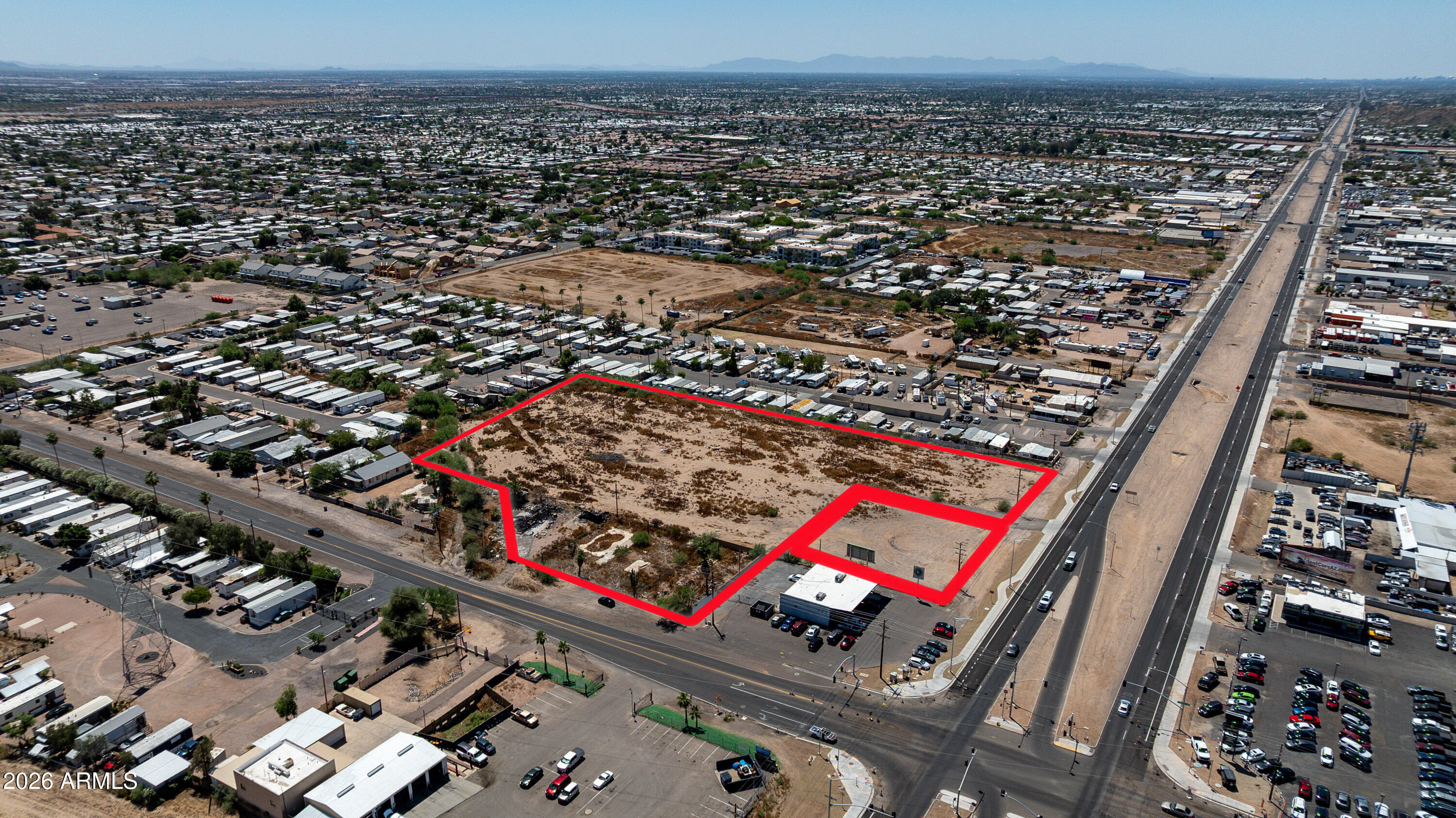 Prime development opportunity with adjacent NNN ground lease included!  $138k existing annual income!!  Rapidly growing Mesa corridor. This unincorporated parcel is strategically located along the south side of Main Street and west of Crismon Road (corner excluded), offering excellent visibility and access. The City of Mesa has expressed interest in annexation, which would allow for municipal water and sewer service availability from mains within the adjacent streets.
The property is primarily zoned R-5, allowing for high-density multi-family development with potential for 40+ units per acre. Frontage along Main Street is zoned C-3 (General Commercial), the most intensive commercial zoning in the County, supporting a wide range of retail, office, and service uses. Utilities including electric and telecommunications are readily available. The site is generally level and mostly cleared, minimizing initial site work. Minor existing improvements along Crismon Road will require removal prior to development.
Approximately 30,000 SF along Main Street is currently under a ground lease, with rental income increasing to $138,000 annually in May 2026, providing interim income potential.
The property may be acquired in whole or in part, offering flexibility for a variety of development strategies. Ideal for a mixed-use project in an area experiencing strong demand for both multi-family and commercial development.
