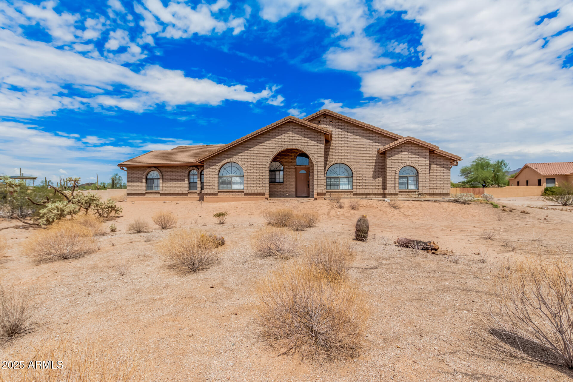 County Island living in this thoughtfully designed, custom-built home with no HOA in Northeast Mesa. Built with comfort and wheelchair accessibility in mind, the home features a roll-in shower, roll-under sinks, extra-wide doorways, flat interior transitions, and three push-plate and remote-controlled entry doors. Recent updates include new stainless steel appliances, Corian countertops, cabinetry, and new flooring throughout. Solid block construction with cement tile roof adds lasting quality. Situated on 1.31 acres with block wall and RV gate. Enjoy quiet afternoons in the bright sunroom or the expansive backyard. Convenient to shopping, medical services, golf, recreation, and highly rated schools--ideal for aging comfortably in place or multigenerational living. Spend quiet afternoons in the bright sunroom, perfect for enjoying the warm Arizona weather year-round. Outside, you'll find an attached storage shed and a vast backyard that offers tons of space for crafting your dream outdoor oasis. Don't miss this gem!