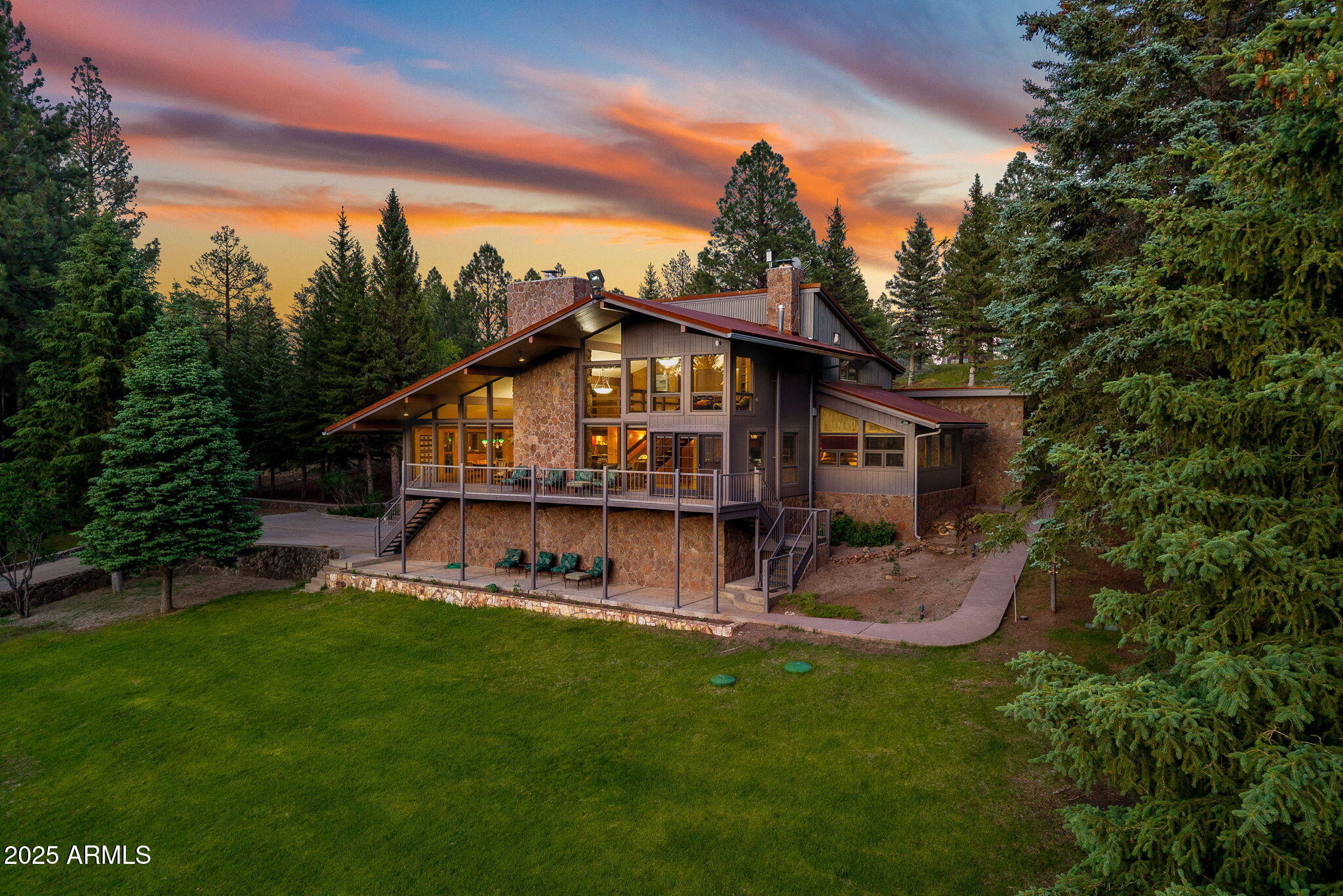 A rare, legacy offering in Greer, Az to own a 17+ acre creekfront estate. Boasting unobstructed views of Hall Creek and 3-private trout ponds from your patio, this property is in a class by itself. The primary residence features a timelessly designed exterior with a meticulously maintained interior of locally sourced high-end materials that complement the natural beauty of this pastoral setting. The thoughtful three-level layout of the main house fancies a grand entry, a living and dining room combination with floor-to-ceiling windows and a beautiful rock fireplace, a luxurious primary suite, four guest suites, a chef's kitchen with high-end appliances and fixtures, an indoor hot tub with picturesque mountain views and fireplace with a petrified wood mantel, and a heated, two-car garage. This gated compound also has a 3-bedroom quaint guest house, heated workshop/barn, 2 special outdoor entertaining areas, one by the main house complete with smokers, fireplace and custom wood-fired pizza oven, the other Creekside with a firepit, large grill, children's play equipment and a fly fishing casting dock, and a lovely green house to wow your guest with on-property grown fruits and vegetables. This remarkable retreat offers a rare combination of seclusion, sophistication, and conveniencejust moments from the Village of Greer, Sunrise Ski Resort and thousands of National Forest acres. A true legacy property for those who demand the very best.