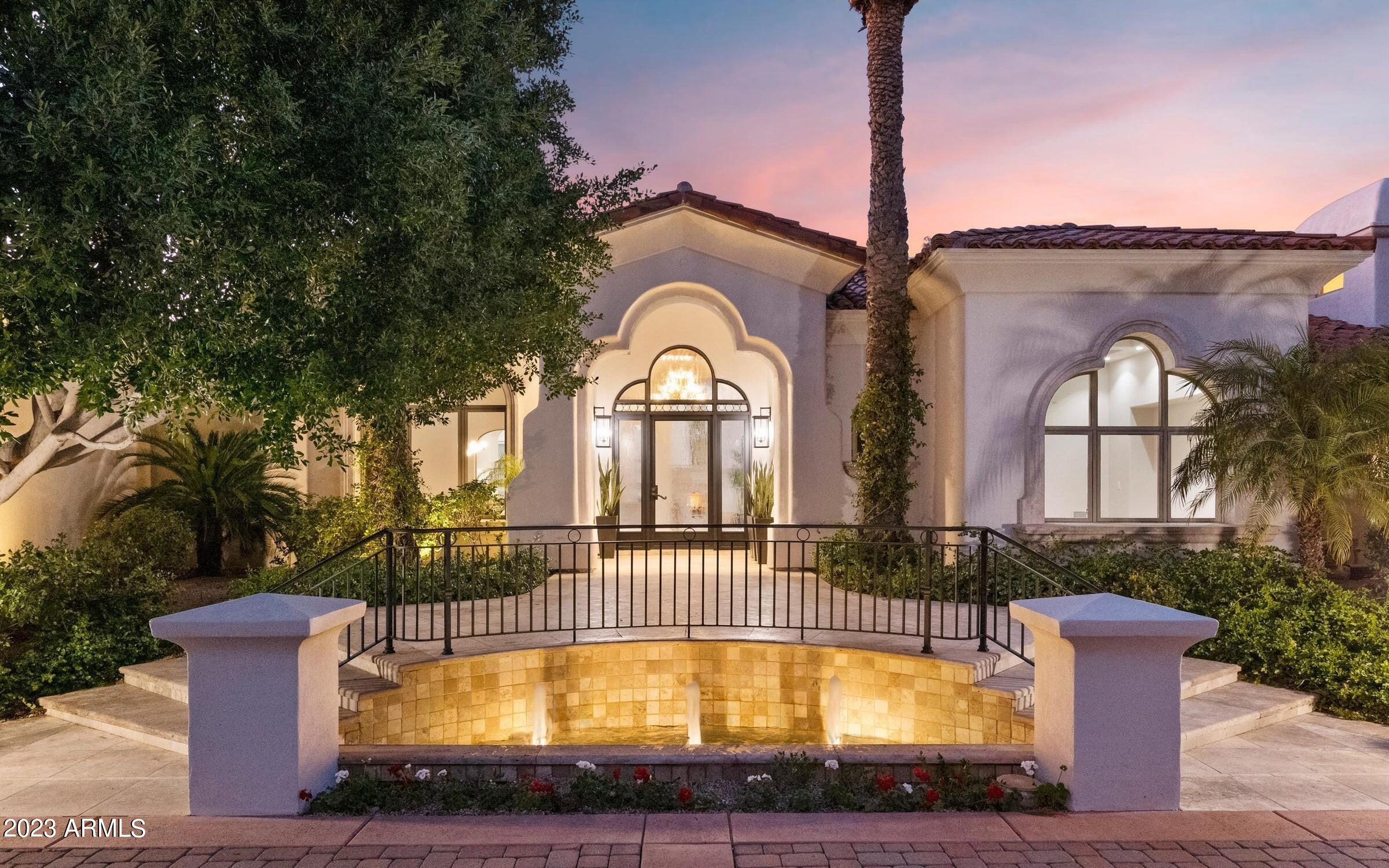 Stunning turnkey Santa Barbara remodel located in Paradise Mansion Estates with views of Phoenix Mountain Preserve. The primary suite retreat is equipped with a gym, large steam shower, sauna, stand alone soaking tub, and his & hers closets. The current owner put $500k into updates including a new Barcelona capped roof, all additional baths remodeled, 4 custom built-in cabinets, new garage doors, exterior lighting, full interior level 5 drywall with new paint and more! The home features a split open floor plan concept, chef's kitchen which opens to the resort style backyard, bar w/ wine fridge, SmartHome System, high-end custom brass fixtures throughout, all additional beds are ensuite, 4 car garage, indoor/outdoor living, massive outdoor patio space, and a bonus room.  This is a must see! Close proximity to the airport, highway access, golf, dining and shopping.