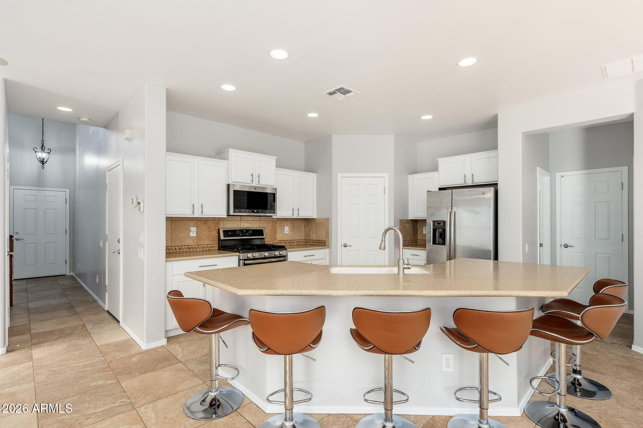 Gorgeous four bedroom home on a corner lot with North South exposure! A desirable downstairs bedroom and a full bath provide the ideal setup for guests or multigen living. The heart of the home is the kitchen featuring white cabinetry, a spacious middle island, granite counters, a walk-in pantry, and stainless appliances opening to the family room, creating the perfect enteraining space. Upstairs, the primary suite is the perfect retreat with dual sinks, a tile shower, tub, and walk-in closet. The fabulous backyard retreat is complete with decorative pavers, a sparkling pool, grassy area, and beautiful views overlooking a vibrant green space. Whether you're hosting gatherings, relaxing poolside, or enjoying the scenery, this home has it all! Close to shopping, dining, and the 101 Freeway.