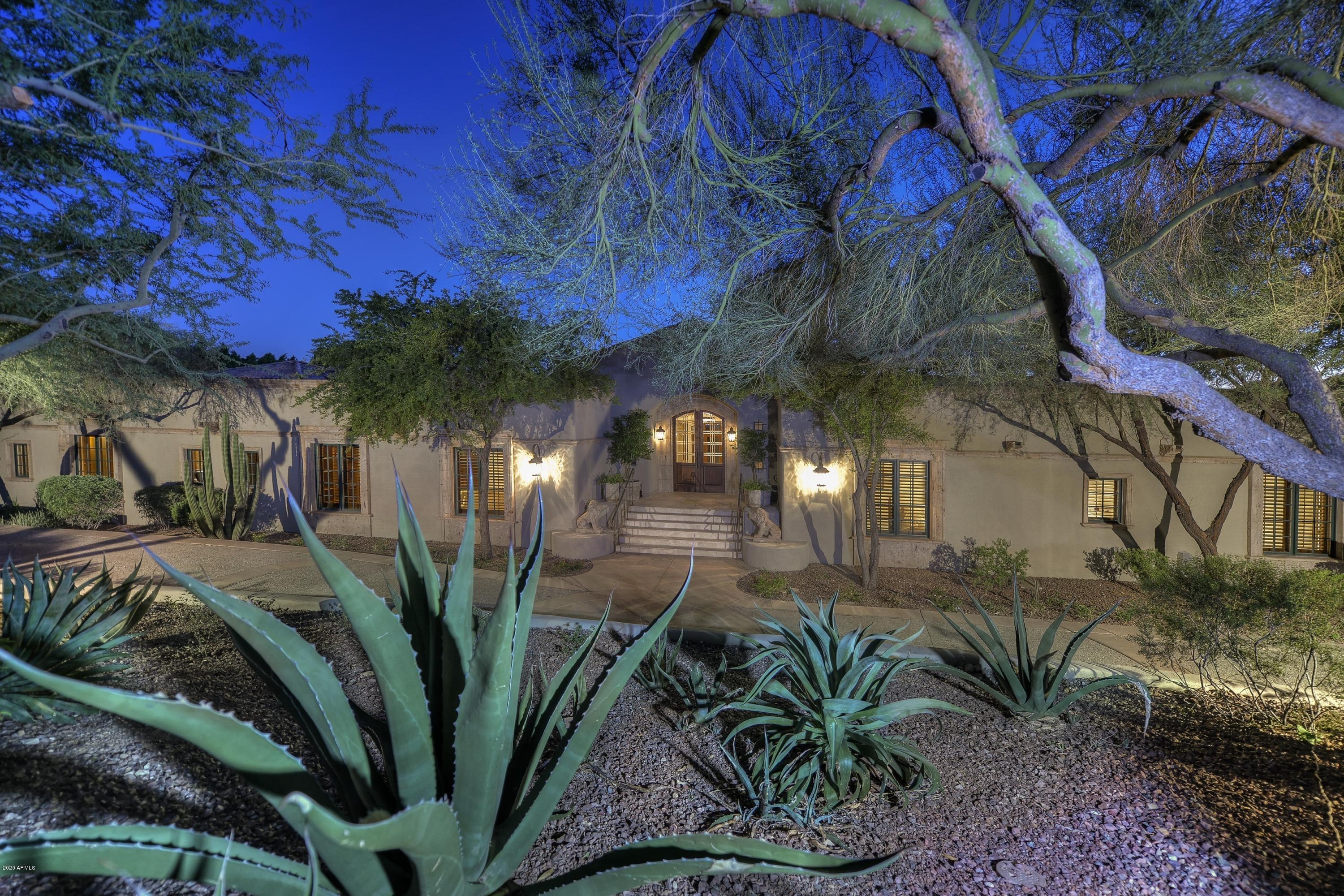 Awe-inspiring setting, timeless design, enhanced views of Camelback Mountain and City lights in the backyard, with Mummy Mountain views towards the front, this estate is fine-tuned to perfection with nearly $700K of beautiful renovations done throughout by the current owners. A tranquil setting from within exclusive Paradise Valley Estates, a wonderful floor plan, on lush private grounds, this quiet and prestigious estate is tucked away on the southwest slope of Mummy Mountain and is walking distance from Paradise Valley Country Club. Your heightened senses upon arrival will boost your interest to explore the home's overall lifestyle experience.  Built for entertaining, with a magnificent balcony that spans the length of the entire home, capturing Camelback, see MOTION VIDEO Camelback Mountain in its entirety, featured and written about as a "front cover" home.  The pool is perfect for swimming laps, or just to enjoy a relaxing day in the sun. The four en suite bedrooms are spacious and the home includes a private office with sauna and steam shower, billiards room/den with a full service bar area, an 1,100 sq ft guest house on the lower level with a kitchen, laundry, and it's own private entrance. High quality, hillside homes with this sort of attention to detail do not become available at this offering price often, so contact us today for your private showing.