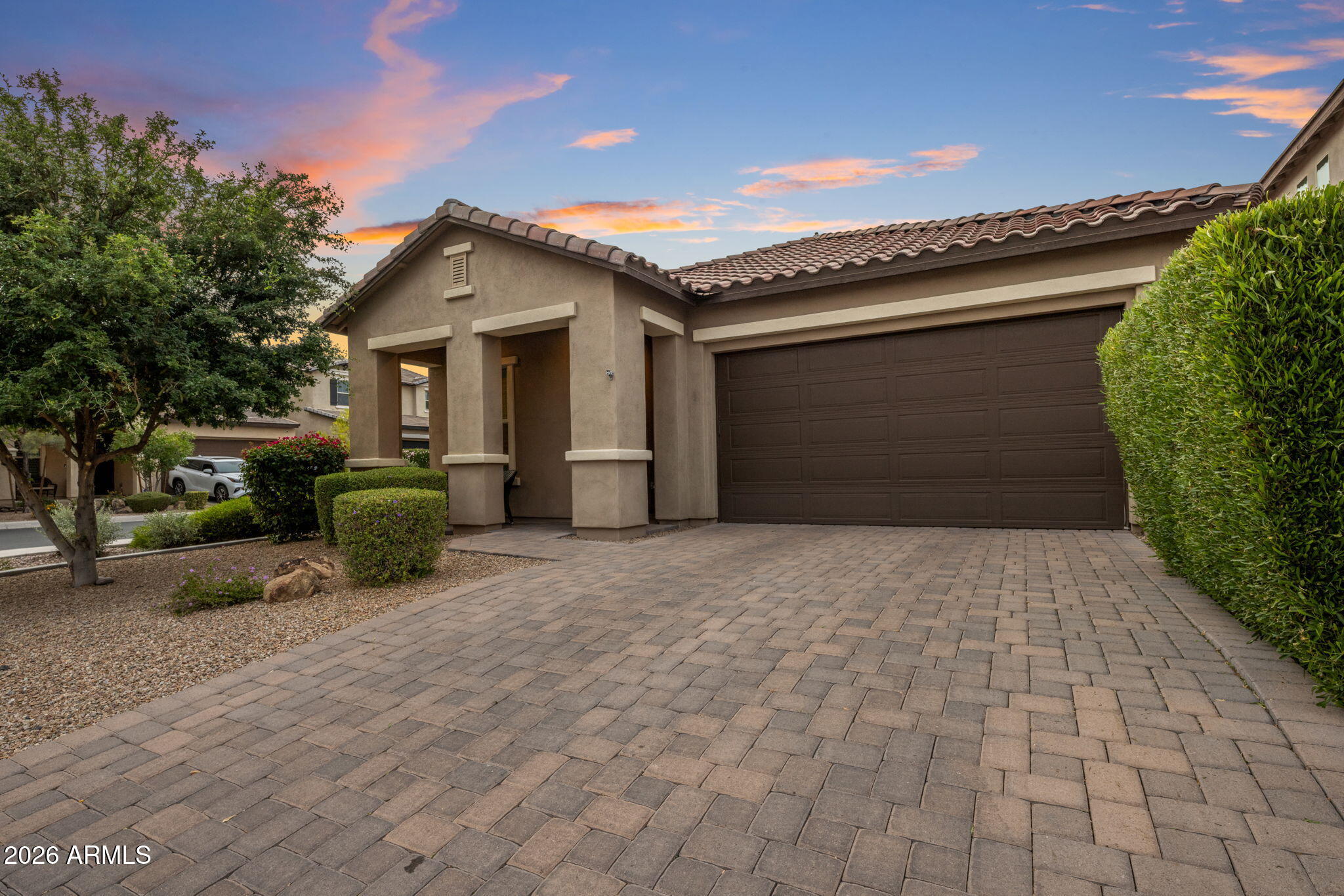 Modern luxury meets an unbeatable lifestyle in this stunning Bluebird floor plan by D.R. Horton, located in the highly desirable Paradise Ridge community. Built in 2019, this sophisticated 4-bedroom, 3-bathroom home greets you with soaring 10-foot ceilings and sleek 12x24 tile flooring that leads into a spectacular open-concept living space. The gourmet kitchen is a true centerpiece, featuring elegant charcoal cabinetry, pristine quartz countertops, and a custom built-in bar designed for effortless entertaining. Large 8-foot sliding glass doors bridge the gap between indoor and outdoor living, opening to a meticulously manicured and private backyard sanctuary that comes complete with professional snake-proof fencing for total peace of mind. Positioned in one of the most convenient corridors in the Valley, this home offers incredible walkability to Whole Foods and Life Time Fitness, while the premier shopping and world-class dining at Kierland Commons and Scottsdale Quarter are just minutes away. This property perfectly captures the essence of contemporary North Phoenix living with every high-end upgrade already in place.