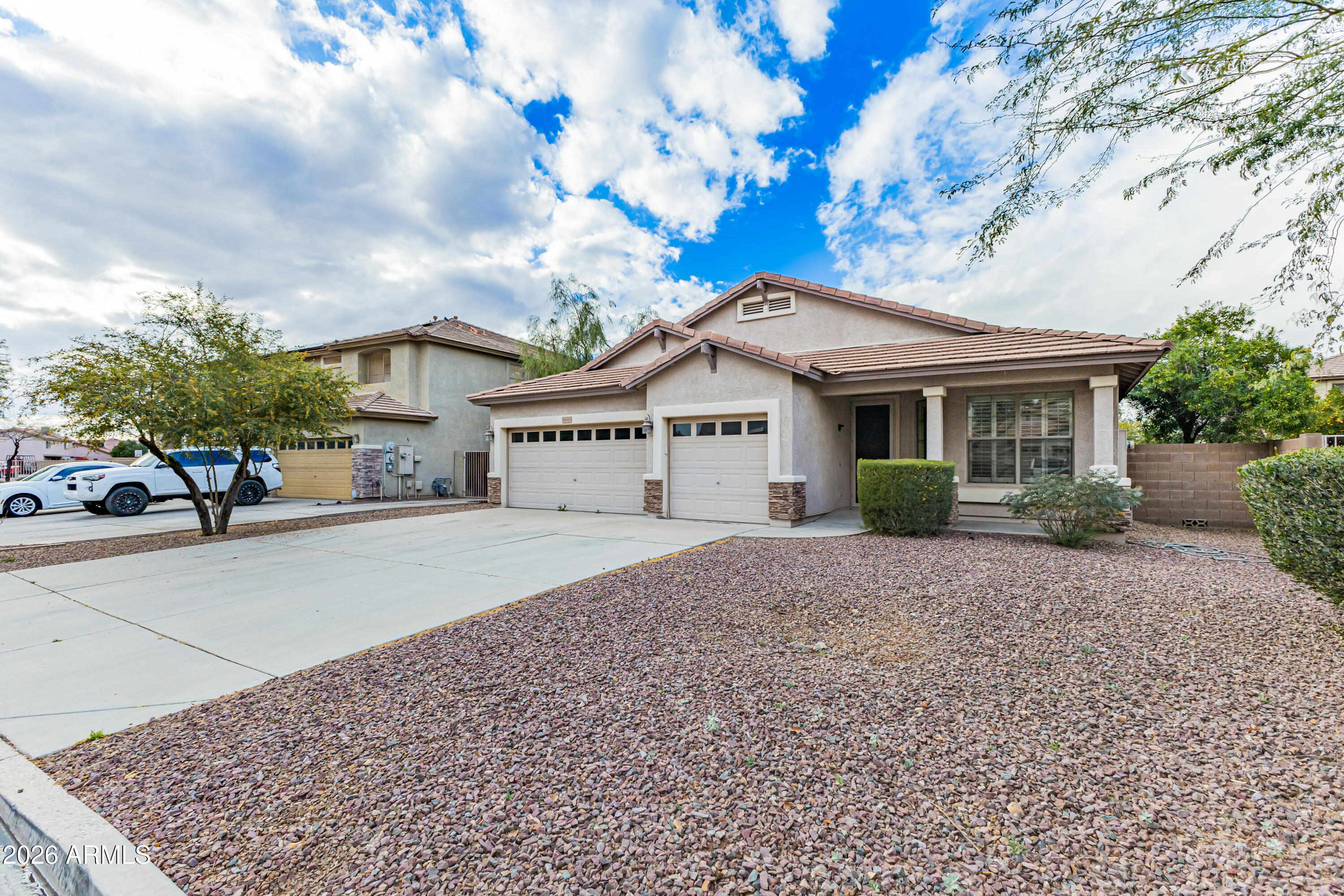 Opportunities like this are rare. Located in a gated community just minutes from downtown Peoria, this single-level ranch home offers an outstanding combination of space, condition, and value: 2,205 square feet with 4 bedrooms, an open split floorplan, and a true 3-car garage--all at an exceptional price point.

Inside, the home feels bright, open, and inviting. The well-designed layout is ideal for both comfortable daily living and easy entertaining. The kitchen sits at the heart of the home with stainless steel appliances, a center island, generous cabinetry, and a large walk-in pantry. Tile flooring runs through all common areas, and the front living room and entry windows feature plantation shutters.

The primary suite provides a private retreat with a sliding door to the patio and a relaxing bath with an oval soaking tub. The fourth bedroom is currently configured as a den/office, offering flexible space that can easily serve as a traditional bedroom when needed.

Additional highlights include dual-zone air conditioning, gas heat and water heater, custom lighting, ceiling fans, and upgraded 7-foot raised panel doors. Outside, the spacious 7,390 sq. ft. lot features mature landscaping with flowering shrubs and shade trees, and residents enjoy access to a private community park within the gated Stoneview neighborhood.

This home has been gently lived in by only a few occupants over the years and is truly move-in ready. It has just been professionally cleaned and is receiving a fresh interior paint update for its next owner.

Homes with this popular single-level floorplan rarely become availableand when they do, they don't last long. Finding a 4-bedroom home with a 3-car garage in a gated Peoria community at this price is a standout opportunity in any market.