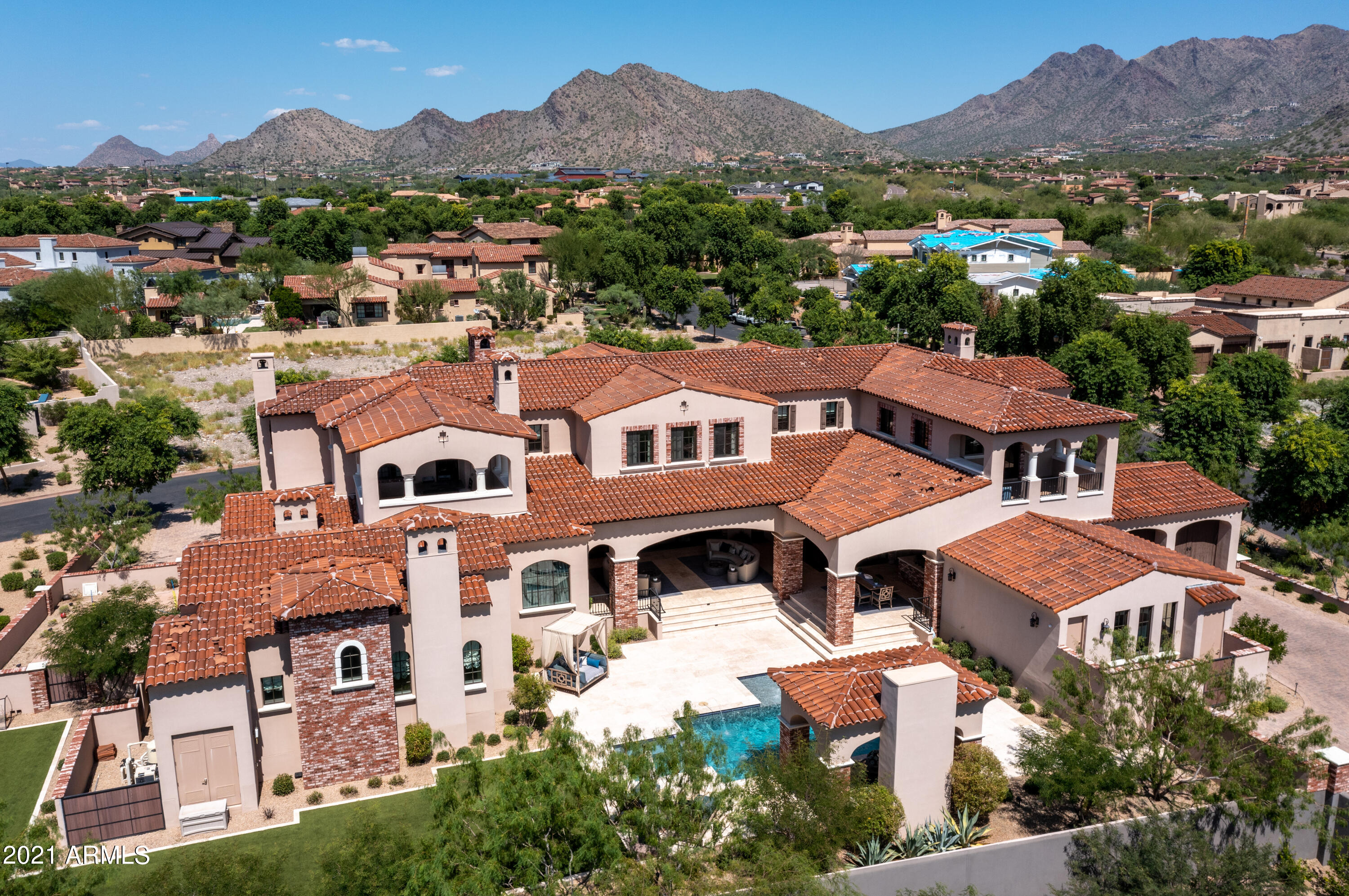 Stunning modern estate with charming drive-up appeal, is nestled on a desirable elevated N/S exposure oversized corner lot in the exclusive guard gated community of Silverleaf Arcadia.  Architecture rich in style and full of grace this well-designed masterpiece focused on deliberate detail maximizing seamless indoor/outdoor living and functionality.  Chic modern character is distinct, with five bedrooms, including an attached separate entry luxury casita with private parking, 5 ensuite baths plus powder and pool bath, 8 fireplaces, two offices, game room, den, and resort backyard, there are limitless living opportunities.   Sensational soaring 26' entry with luxurious living and dining seamlessly open to resort outdoor living with 22' glass automated doors.   (see ''more'') With ease, instantly open your indoor kitchen/dining to outdoor kitchen/dining with automated 90-degree corner glass pocket doors.  The seamless indoor/outdoor living in this estate is unparallel, an entertainer's dream.  Exquisite finishes and details are abound, limestone and wide plank wood flooring, grand chandeliers and striking lighting features, artistic iron railing, beamed ceilings, smart Savant home system.  Enjoy private wet bar, walk-in wine cellar, den/game room downstairs adjacent to family room and impressive kitchen featuring chic white cabs with oversized eat-in island, Quartzite countertops, Wolf/Sub Zero appliances with Wolf coffee maker and steam oven, two dishwashers, and generous walk-in pantry.  First level owner's suite offers a large sitting area with fireplace and access to outdoor living.   Lavish spa-like owner's bath is adorned with marble floors and countertops, free standing tub, expansive marble shower with multiple shower heads, and two water closets.  Find three ensuite bedrooms, theatre room, office/bonus room, den, and large loft on second level with multiple balconies boasting city and mountain views.  Guests enjoy a private entry attached casita with spacious bedroom/kitchenette, bathroom, and laundry facility, with convenient parking to entry.  Charming front yard with lush landscape and grass with covered patio, side yard with sports concrete and turf areas, and resort style backyard with remarkable ramada with fireplace opening to heated pool/spa with lux water features, full outdoor kitchen and dining area, generous covered patio, and hardscape for expansive entertainment and enjoyment.  Arcadia at Silverleaf is located at the base of the McDowell Mountain Range in North Scottsdale, Arizona. Full of character this charming 130 home neighborhood is postcard worthy with tree lined streets and three lush parks within an exclusive guard-gate.  Located in the heart of North Scottsdale, with convenience and amenities, this extraordinarily refined estate is picture perfect for the most discerning clients.