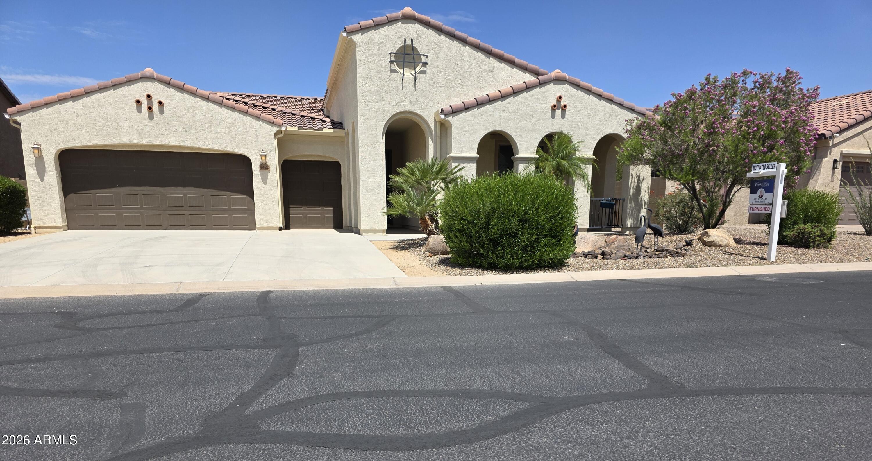 This popular Pavona model is furnished and ready to move in. Featuring a big, open floor plan with upgraded kitchen appliances and cabinets, under cabinet lighting and beautiful quartz countertops. The front bedroom suite with private bath is perfect for out-of-town friends and family.  In the back, you can enjoy the desert landscaping and water feature from the large, covered back patio that is fully screened for year-round use or from the private, paved seating area off to the side.  This home features a two-car garage with an extended driveway plus a separate golf cart garage and entry. Don't miss this one!!